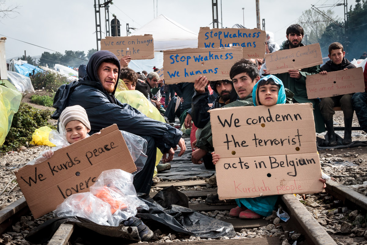 Asylum seekers in Idomeni demonstrate in the aftermath of the March 2016 Brussels bombings.