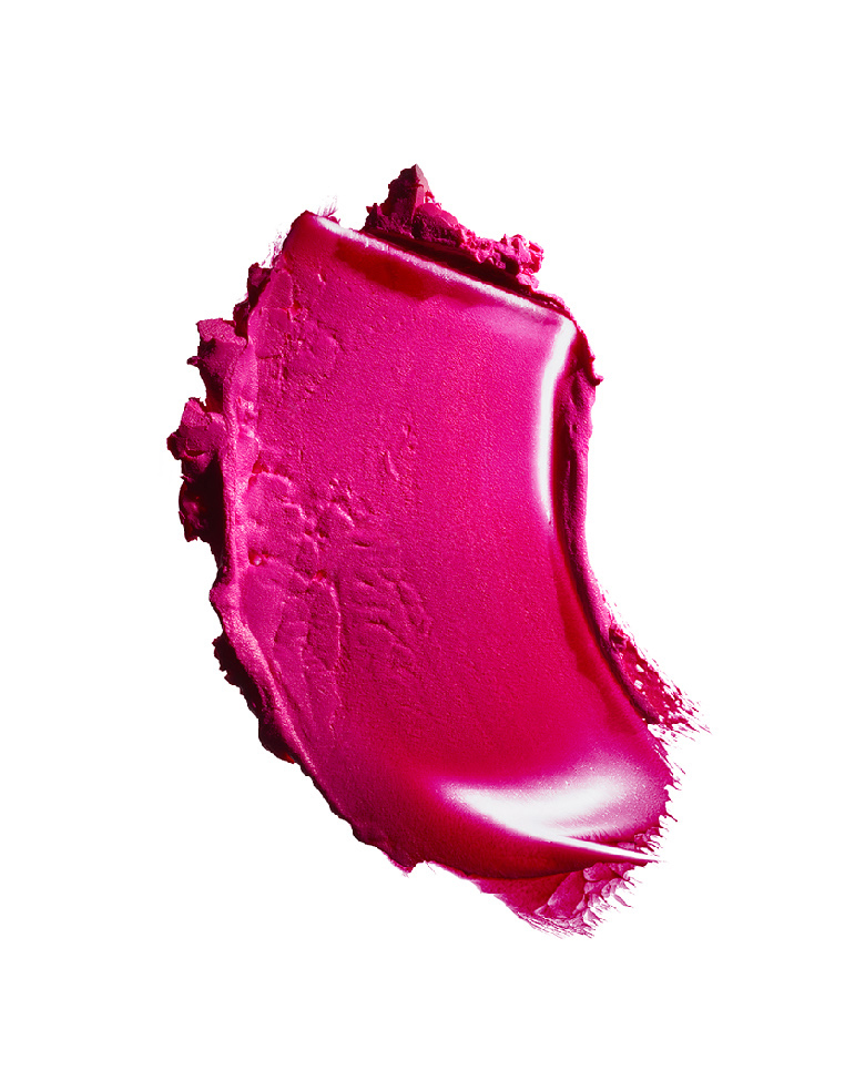 KMA stylist Rachel Haas designs set for photograph of smeared creamy hot pink lipstick against white background for Dior