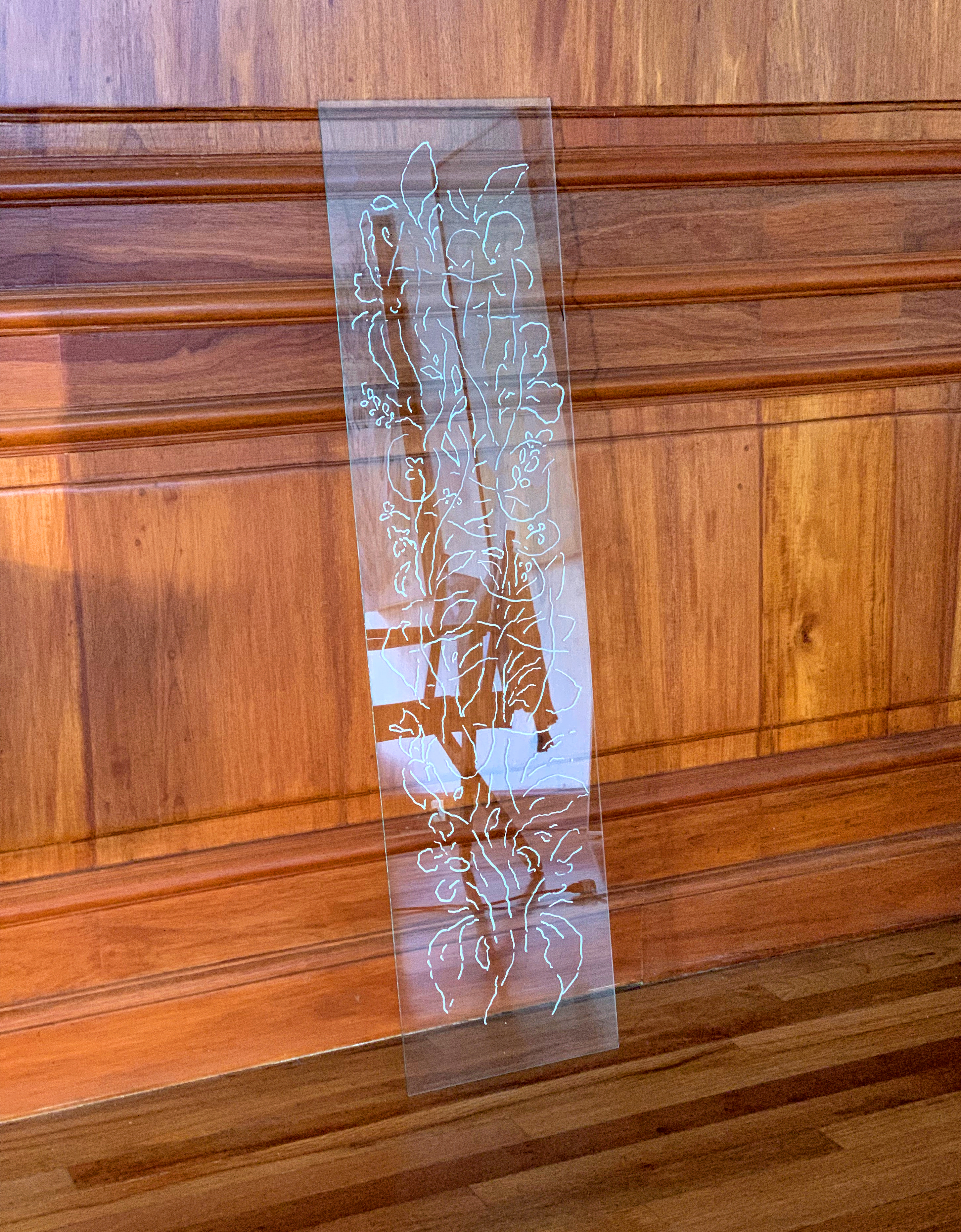 The glass as a dystopian memory, 2022 Industrial wax on mirror glass. 25 × 100 cm