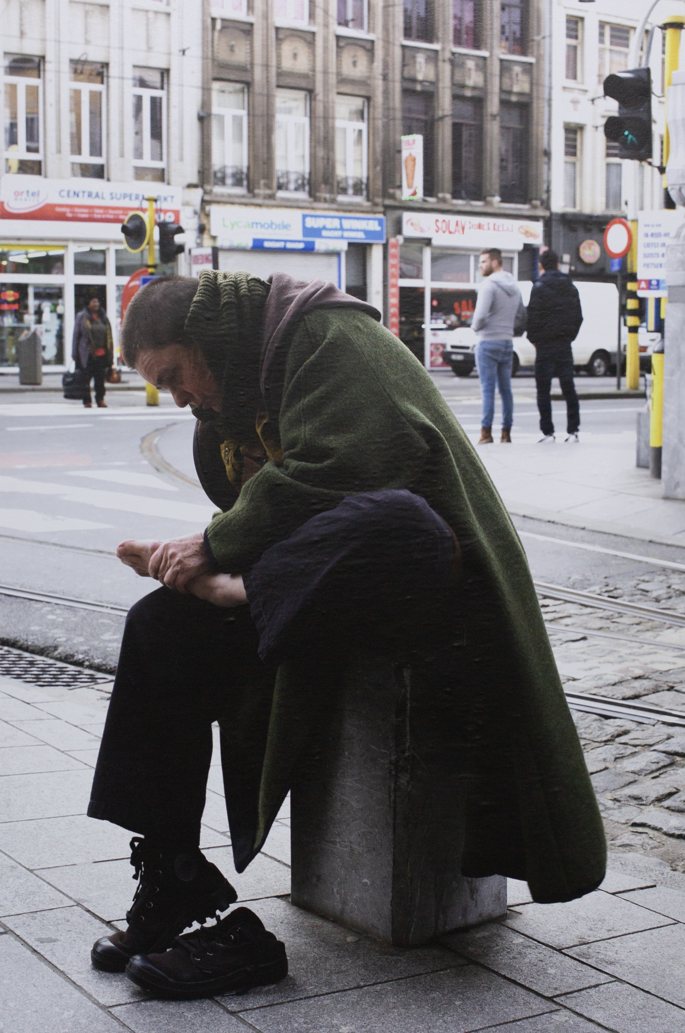 'Woman pulling a thorn from her foot', 2017. Sticker 76 x 111 cm