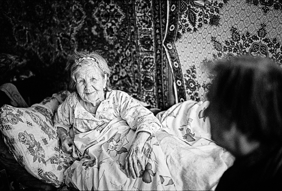 Two refugees from Baku - Lilian (86) and her mentally disabled son (57) - in their tiny room in a former hotel near Yerevan, where they have been living for over 20 years.