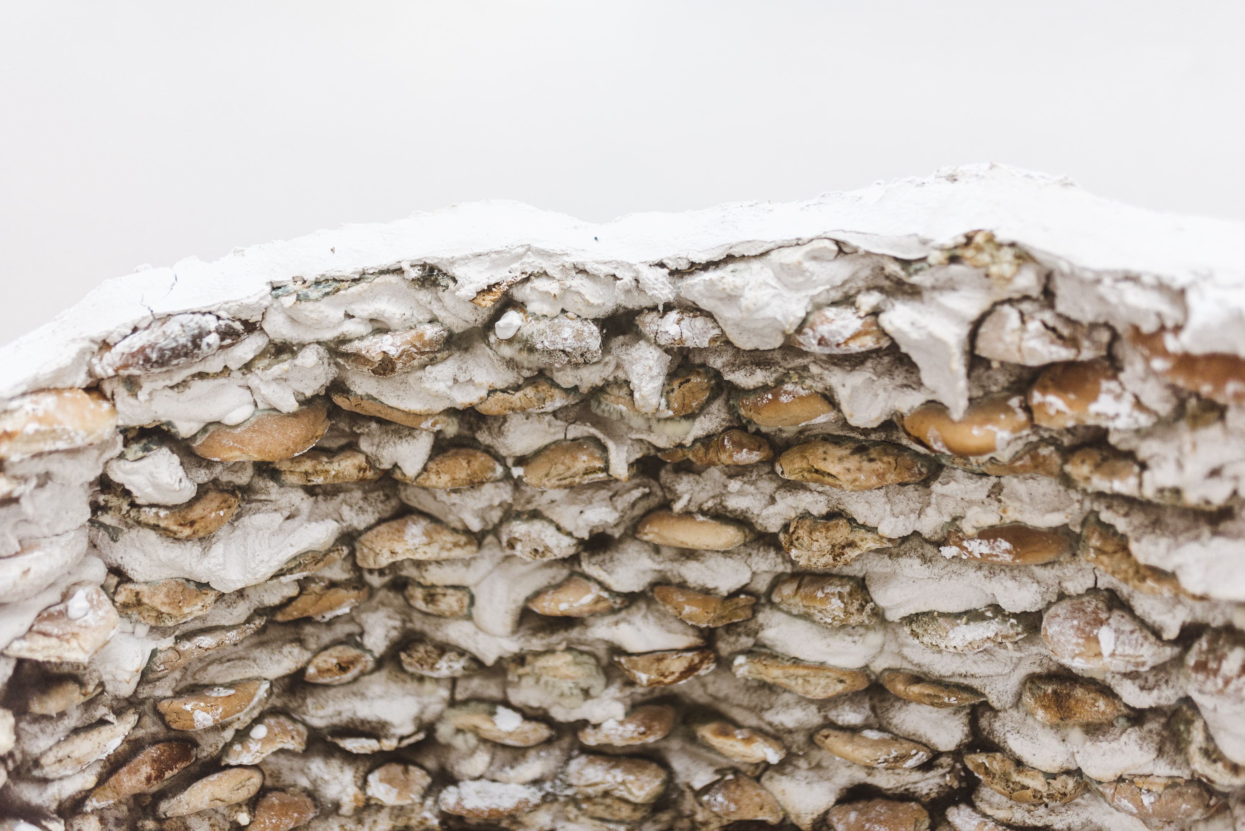 “Cráteres”, 2021, in collaboration with Aldahir Montaño. Bread and plaster sculptures, variable dimensions. Vigil Gonzales Gallery, Urubamba, Perú