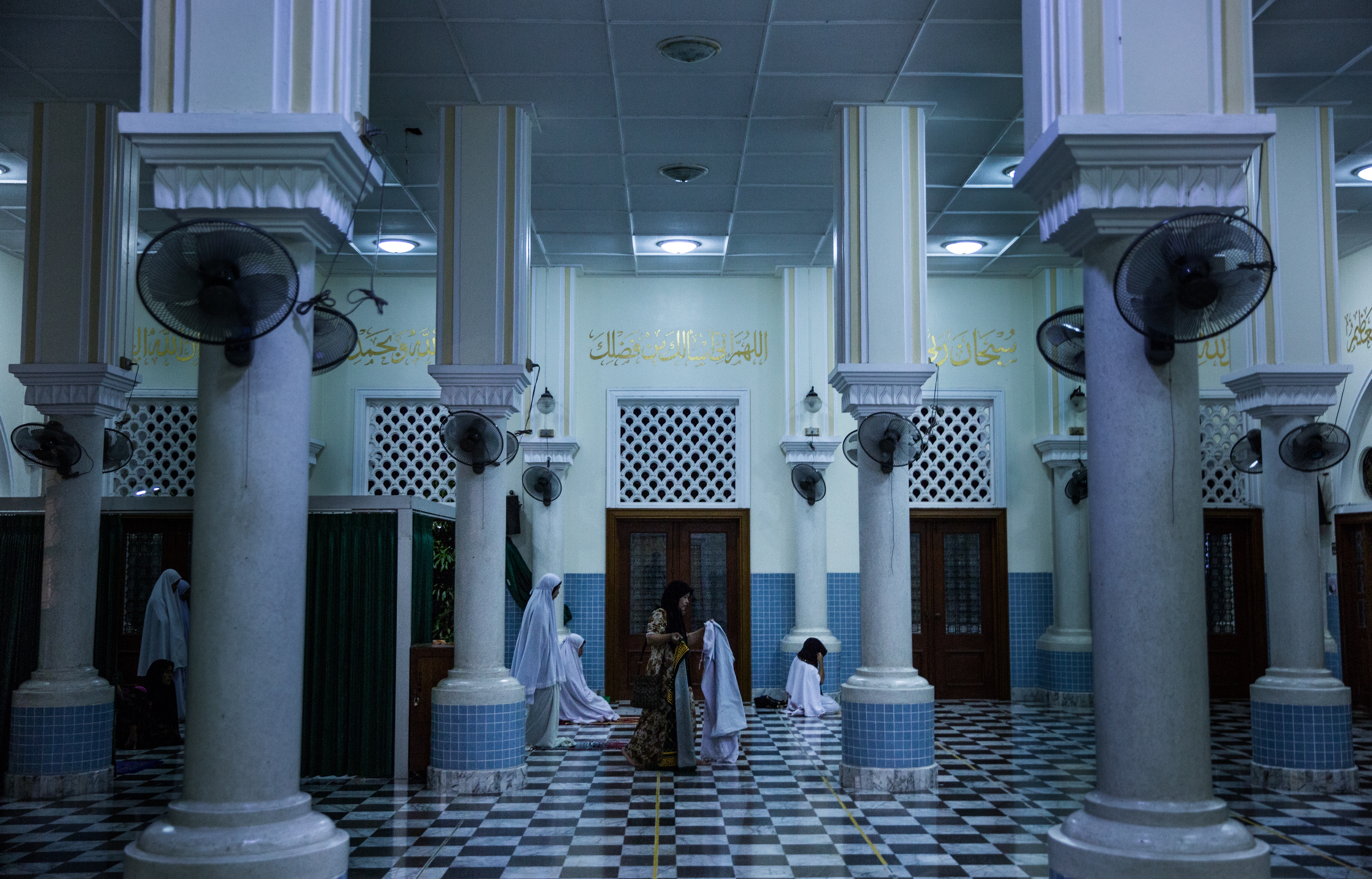 Women prepare for evening prayer in Pattani Central Mosque, Pattani province, Thailand on November 14, 2017