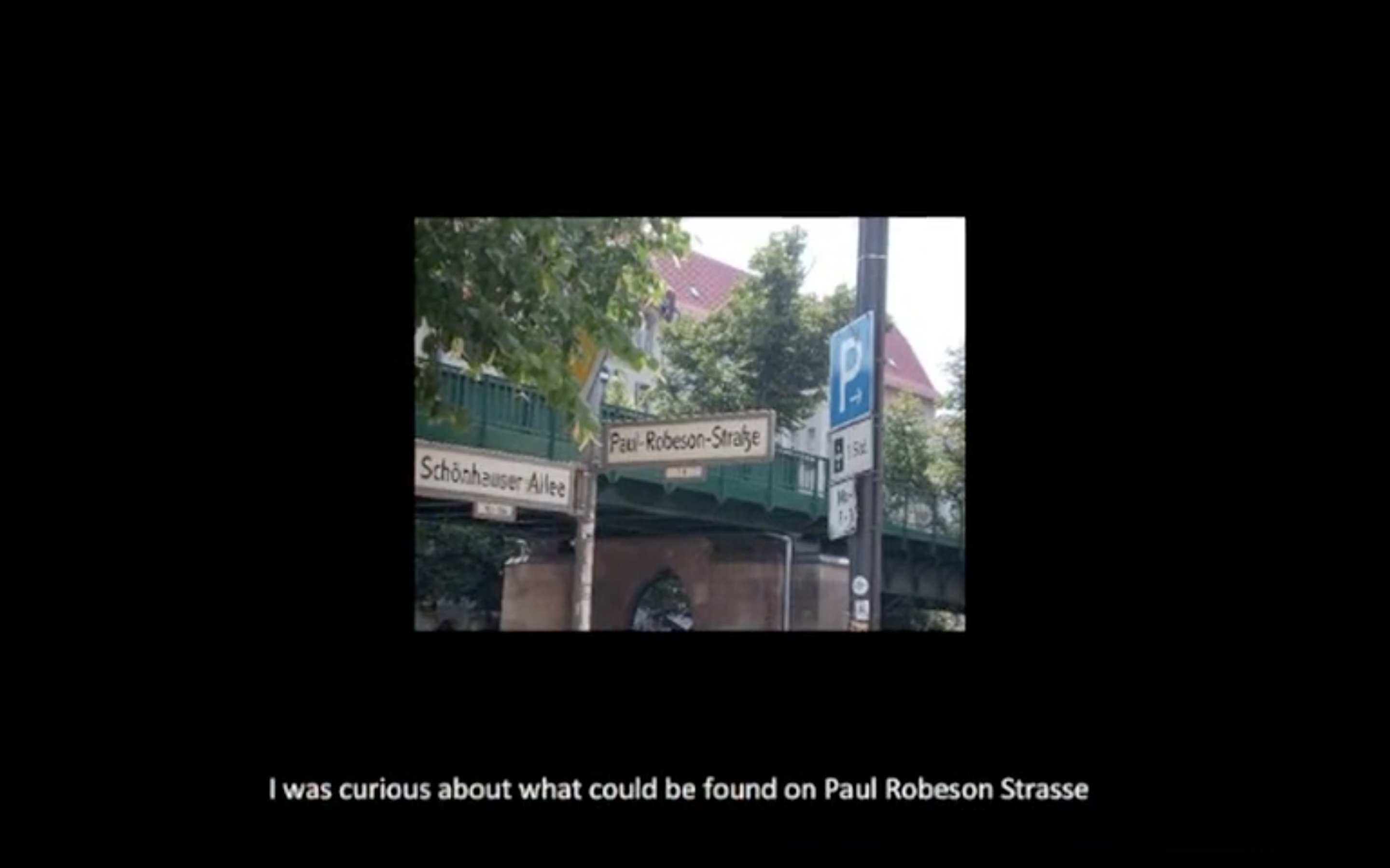 Film still showing the corner of Shönhauser Alle and Paul Robeson Strasse, Berlin.