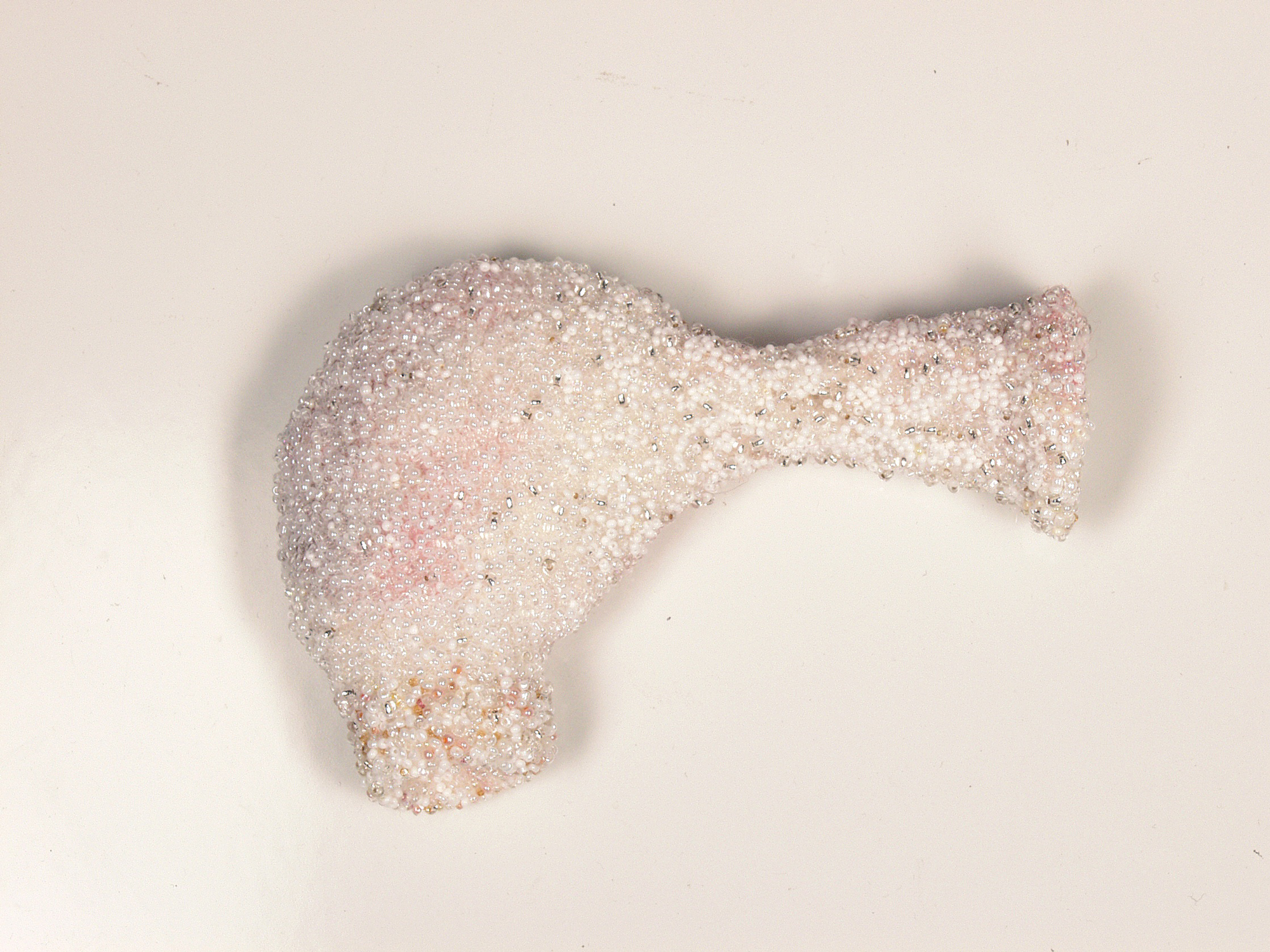  Brancos, 2002/2003 . Hand made felt, hair, fragments of silk and cotton embroidered with glass beads . 17 cm . Private Collection Amsterdam, The Netherlands