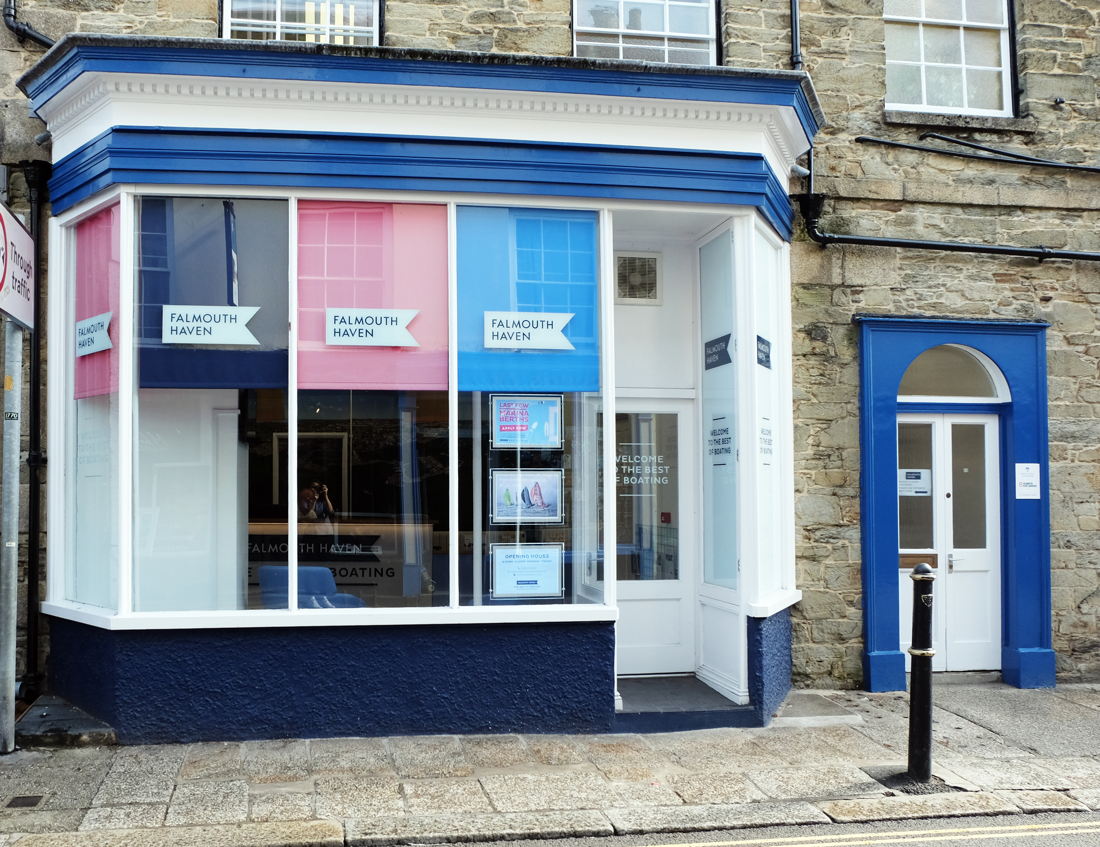 Street view of client’s exterior. Navy, pink and blue blinds on interior, with branding on glazing. Main entrance set back. 