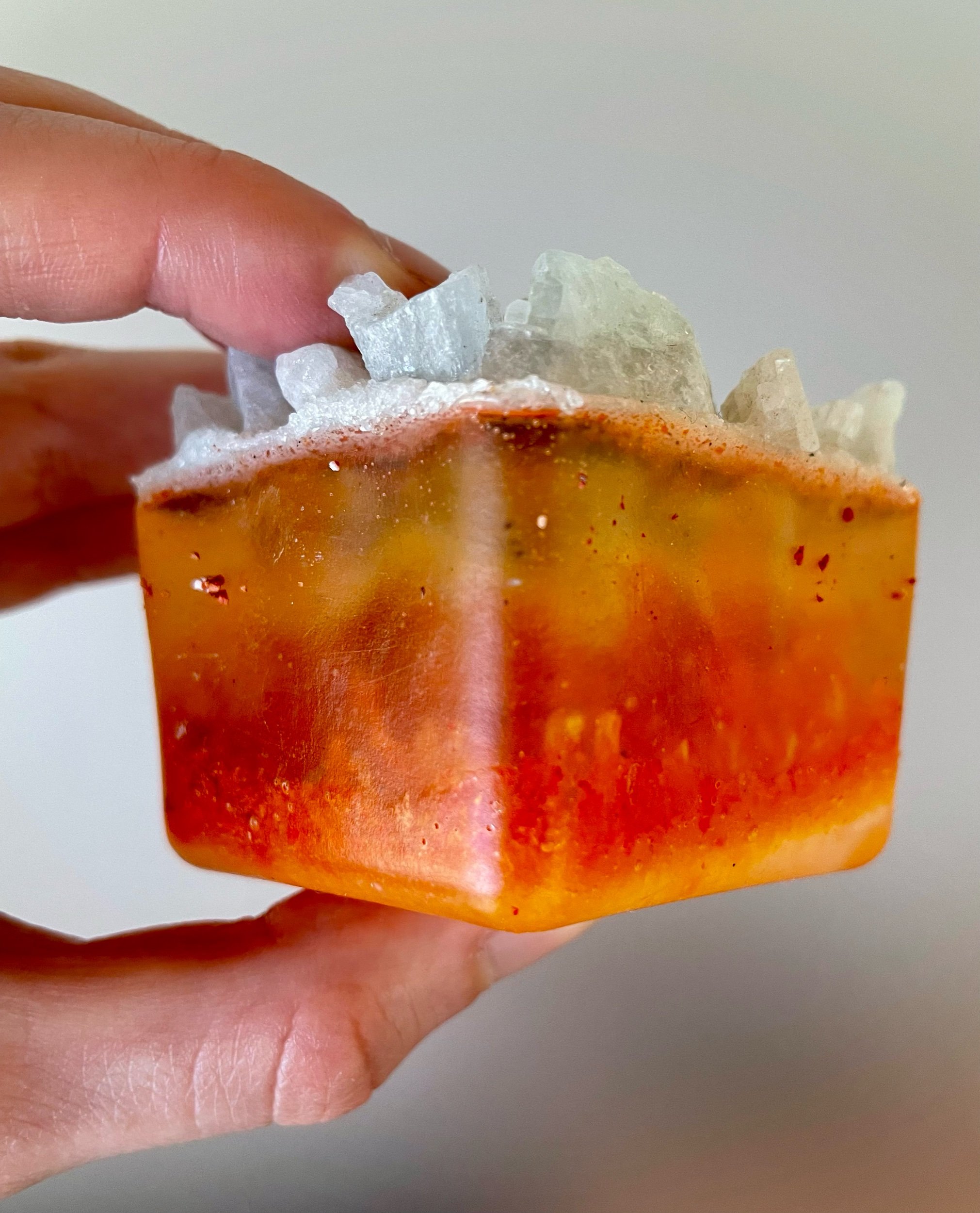 Orange Terraform I & II: Orange and Cream; Aquamarine, crystal quartz, phosphorescent mineral powder, dyed pumice, glass, resin, 2”x2”x2.5”