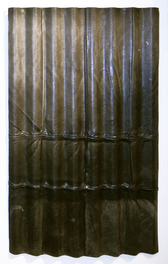 Eine Beziehung endet an der Wand, 2017, leather on corrugated metal, 127 x 81 cm