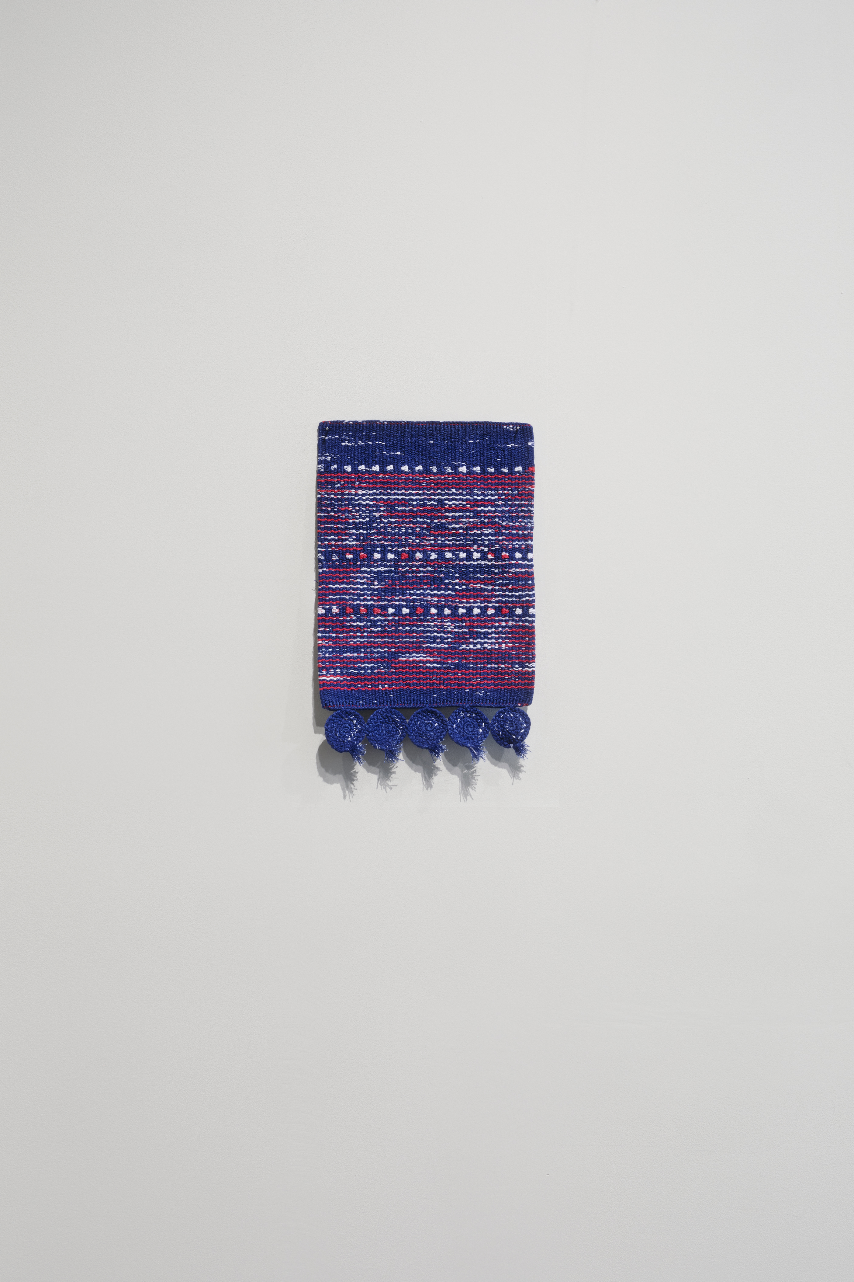 Sanne Vaassen, woven by Sara Lindsay, from the series FLAGS, 2018, rewoven flag, Australia, 12" x 8."