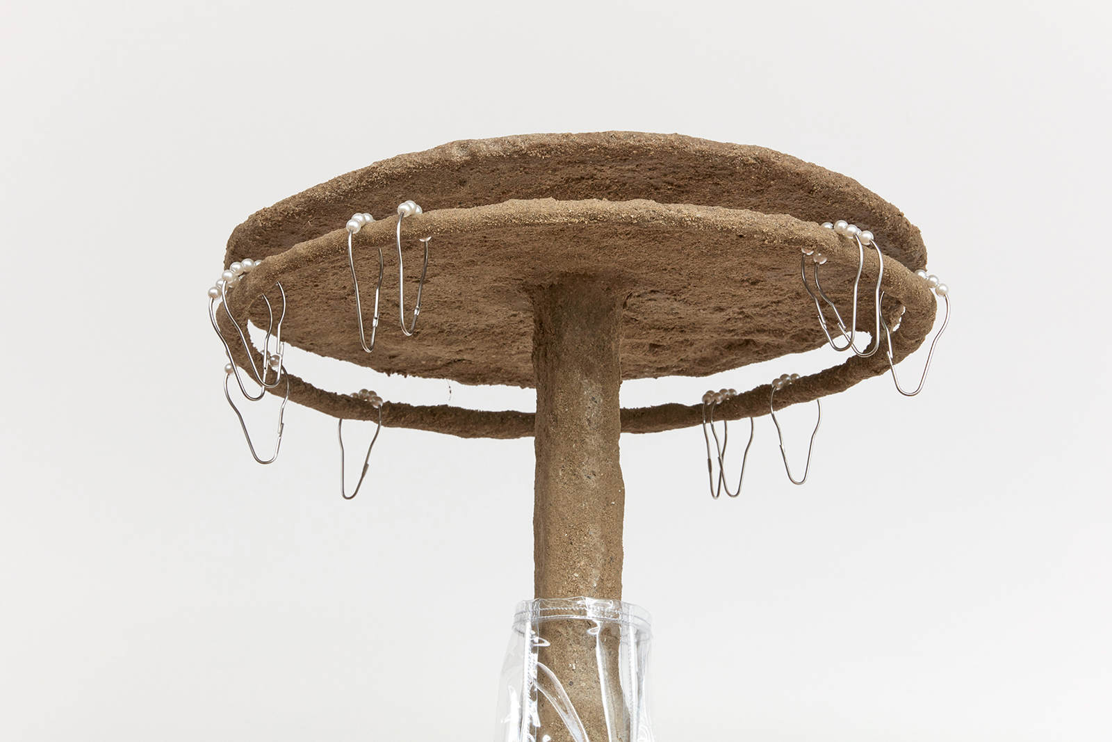 Untitled (little Shower), 2021, steel, sand, polymer, burlap, rock, vinyl, shower curtain hooks