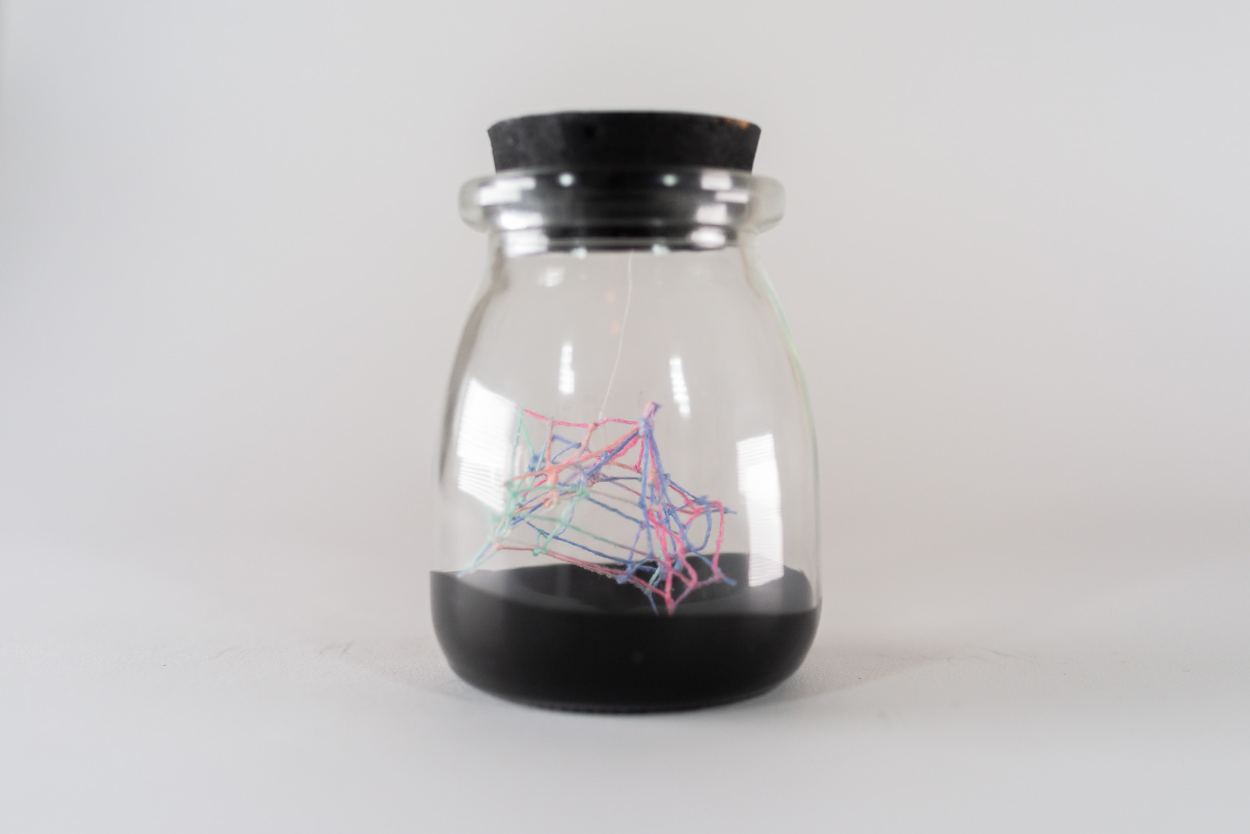 Small Ideas 4 • Embroidery floss, paint, glass jar • 2 1/4 x 2 1/4 x 3 1/2 in • 2022