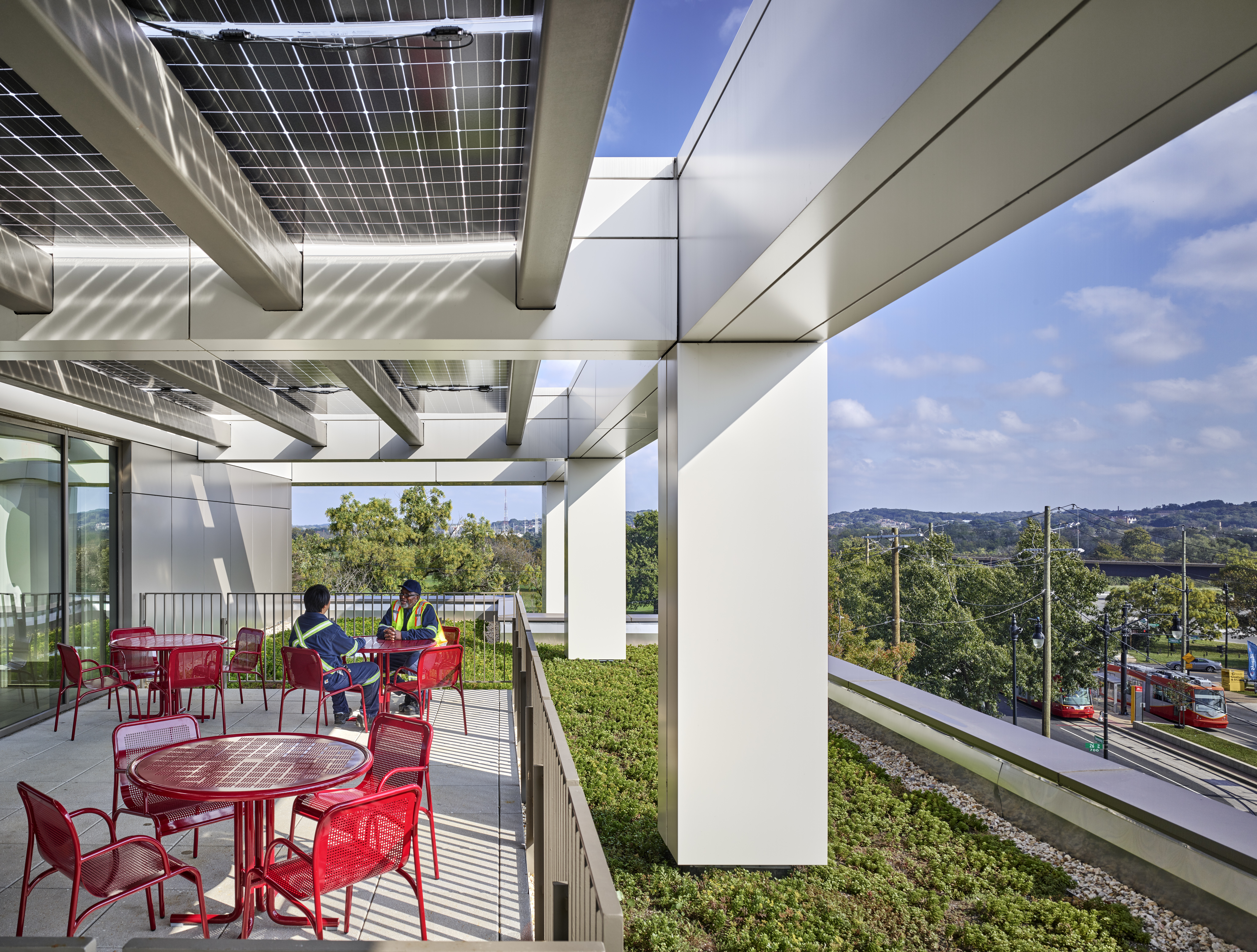 Rooftop terrace with overhead photovoltaic panels