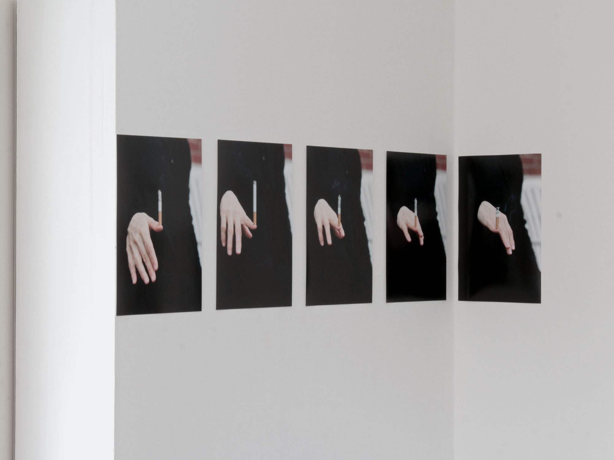 Untitled (Cigarette on Fingernail), 2019 [installation view]Giclée print on paper.5 photographs: 30 x 20 cm. each.
