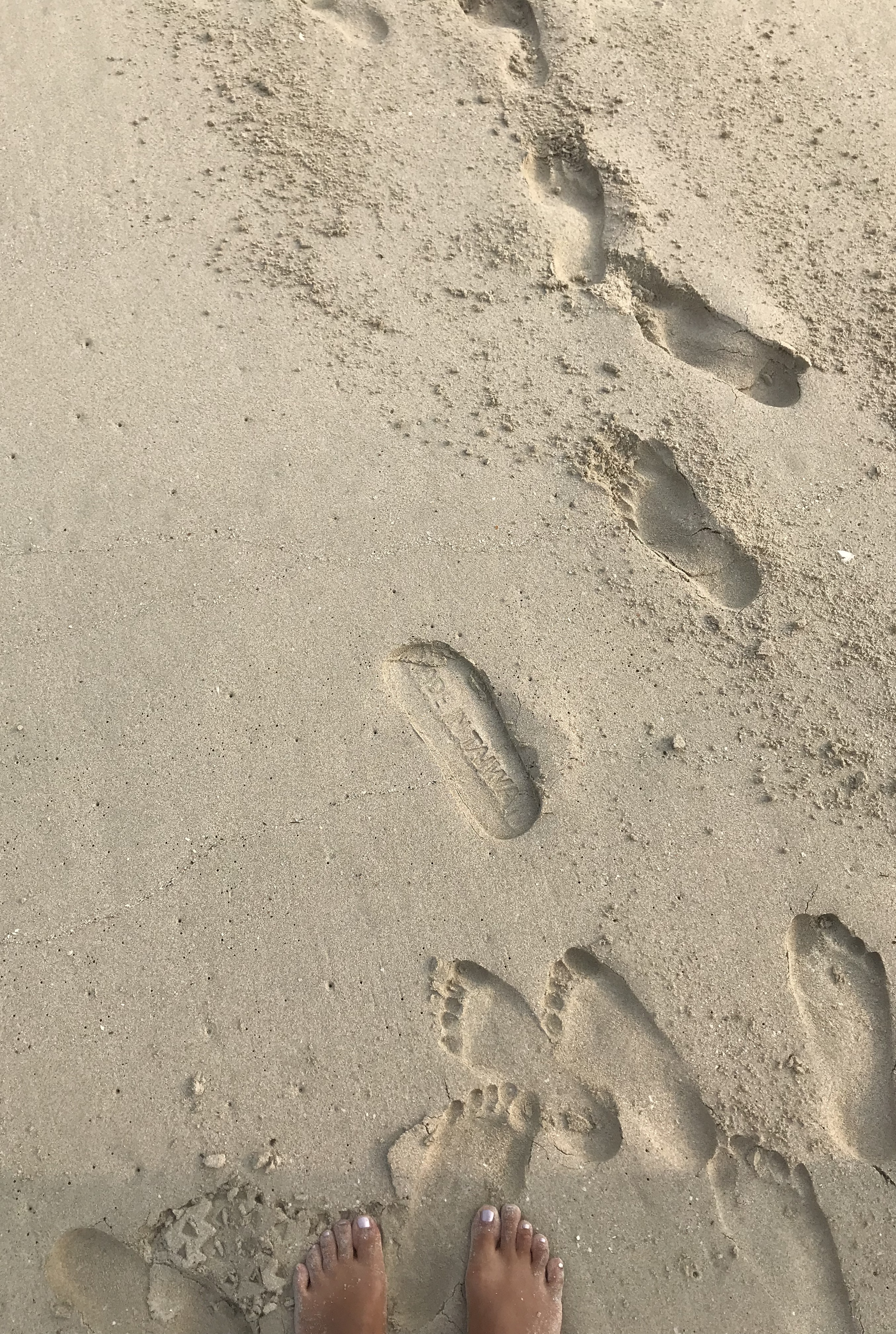 Flipflops on sand. Sai Kung, Hong Kong. October, 2019