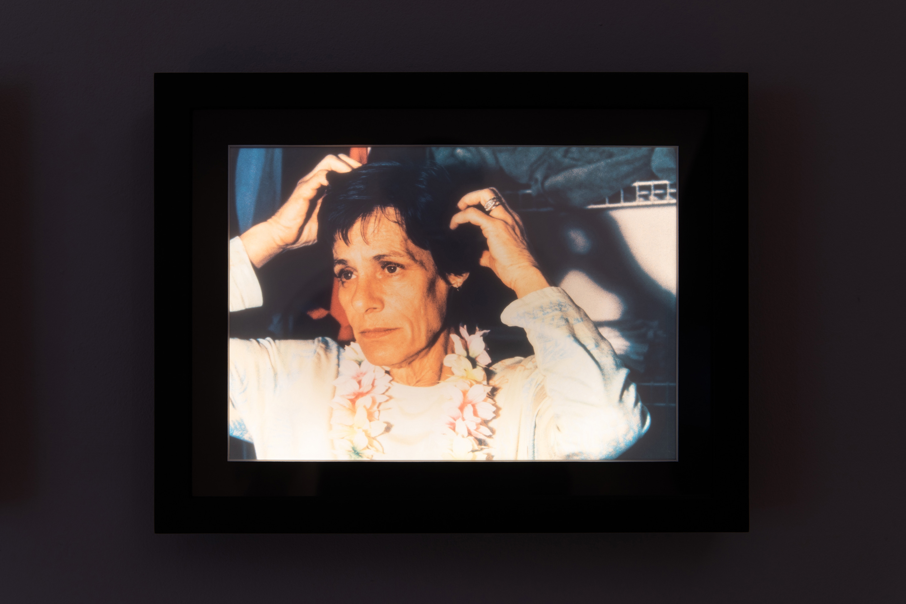 "Althea in her wardrobe II," 2008 (printed 2022), transparency in LED lightbox, 9" x 12" x 1"