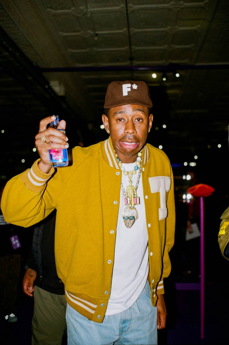 Tyler the Creator holding water bottle at 'Son of a Pharaoh' preview event
