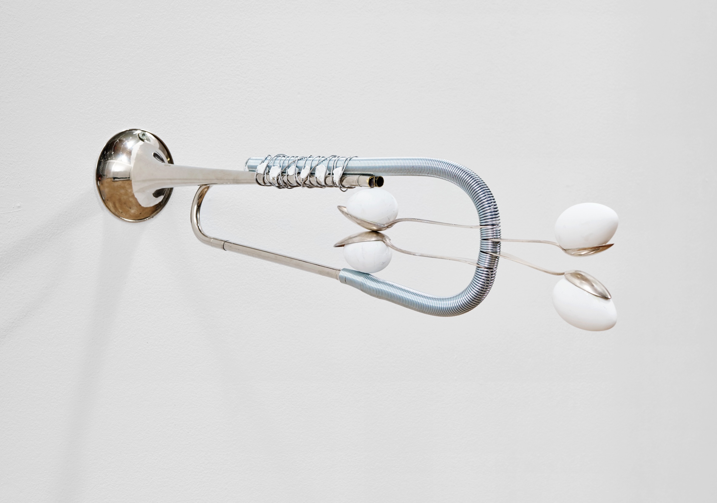 Fringe, 2025 Silver-plated horn, silver spoons, spring and eggs 12.5 x 16 x 69 cm 4.9 x 6.3 x 27.2 inches