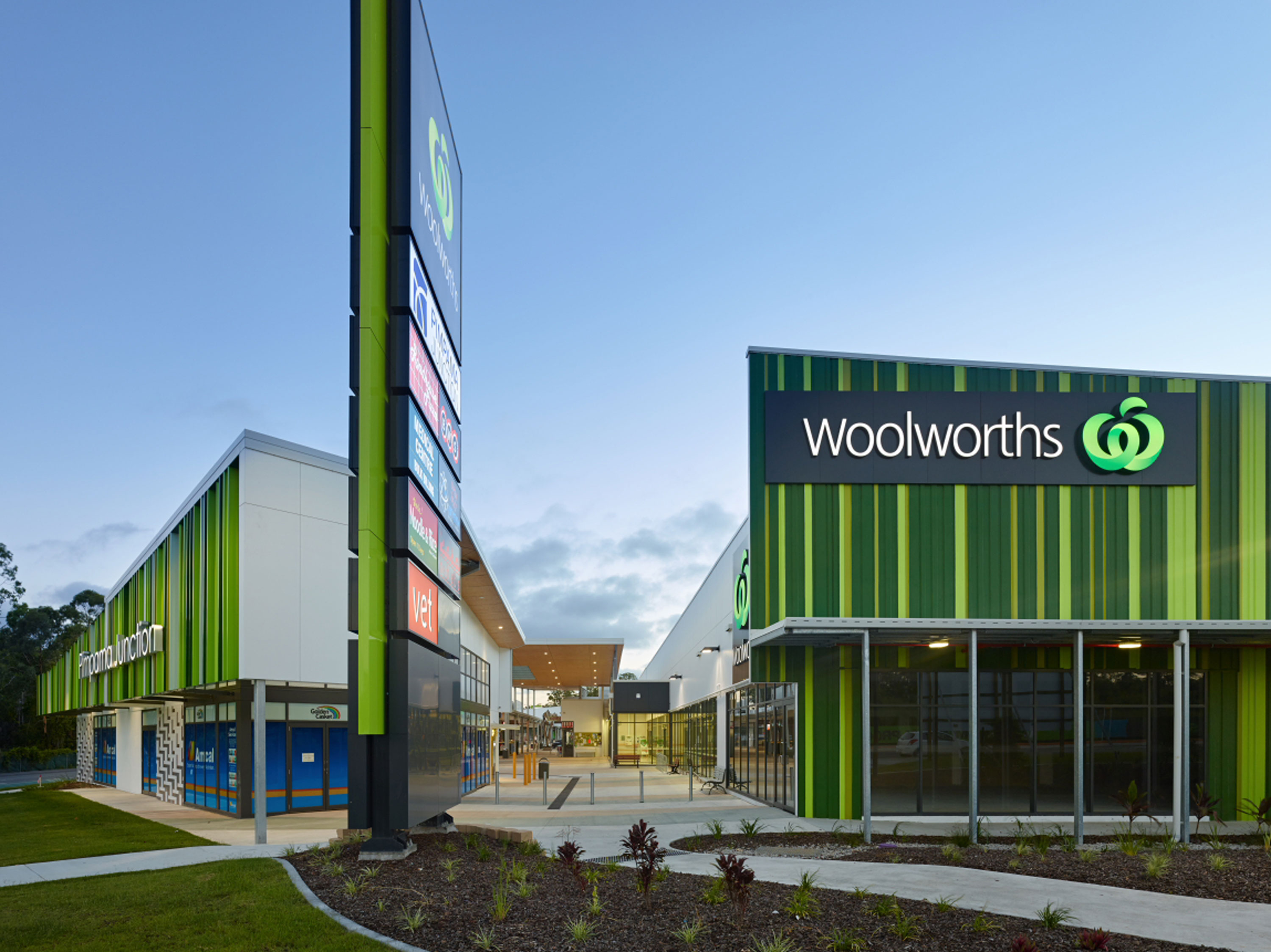 Coloured battens define the Pimpama Junction Village, featuring Woolworths' new city store, and a modern retail space showcasing a wide range of tenancies.