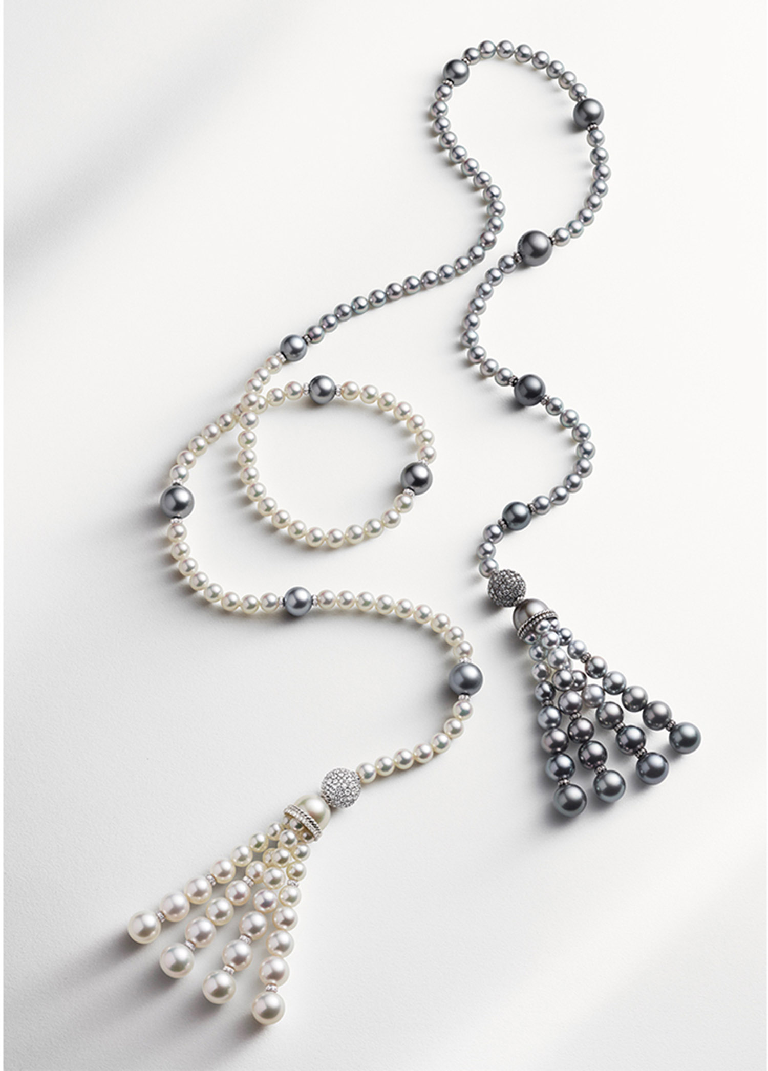 KMA stylist Sara Wacksman designs set for a photo of a white and grey pearl necklace with a white background for David Yurman