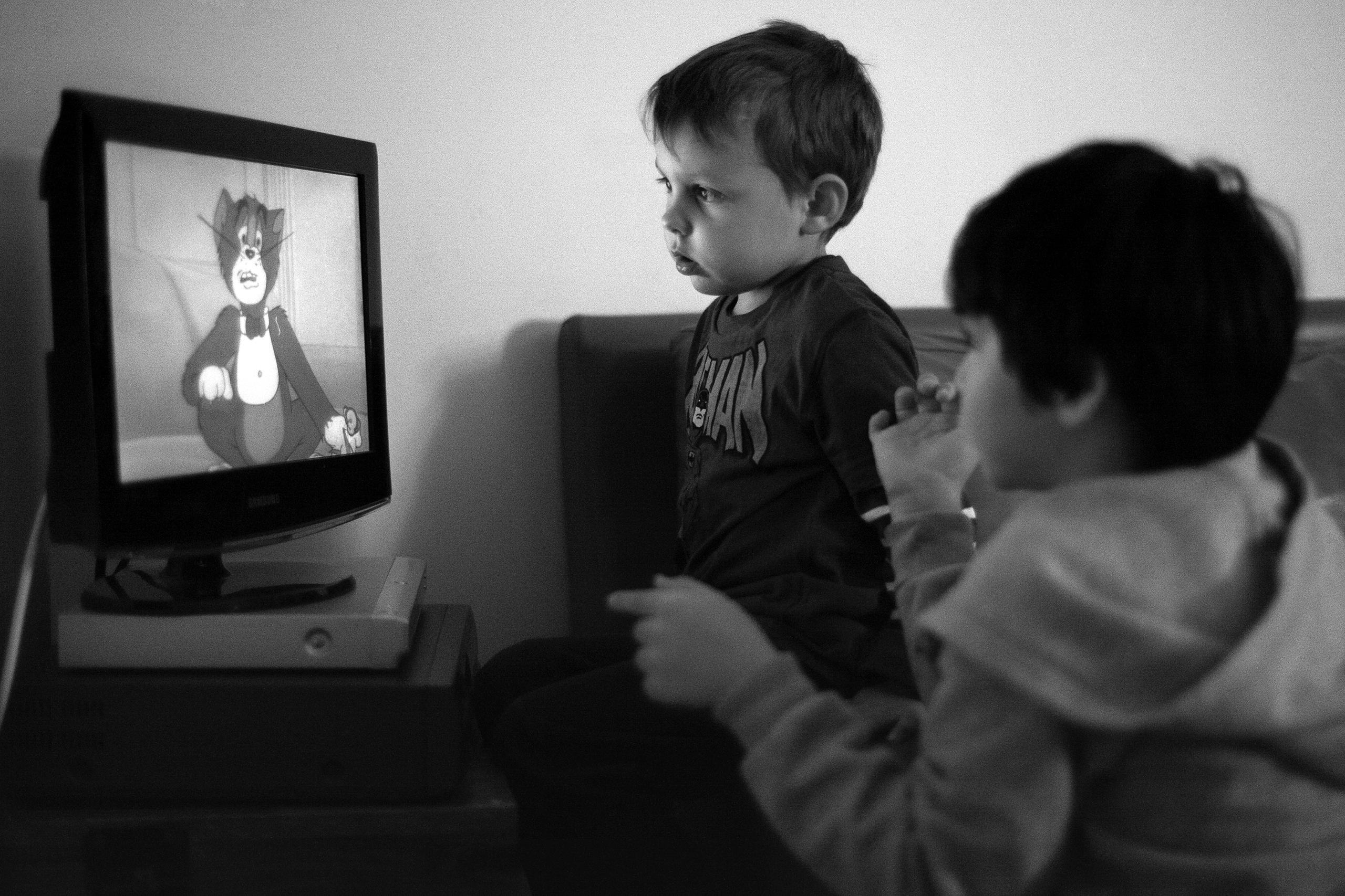 Marc and Anton watching Tom on TVBarcelona, Spain, 2013photography, bw, single