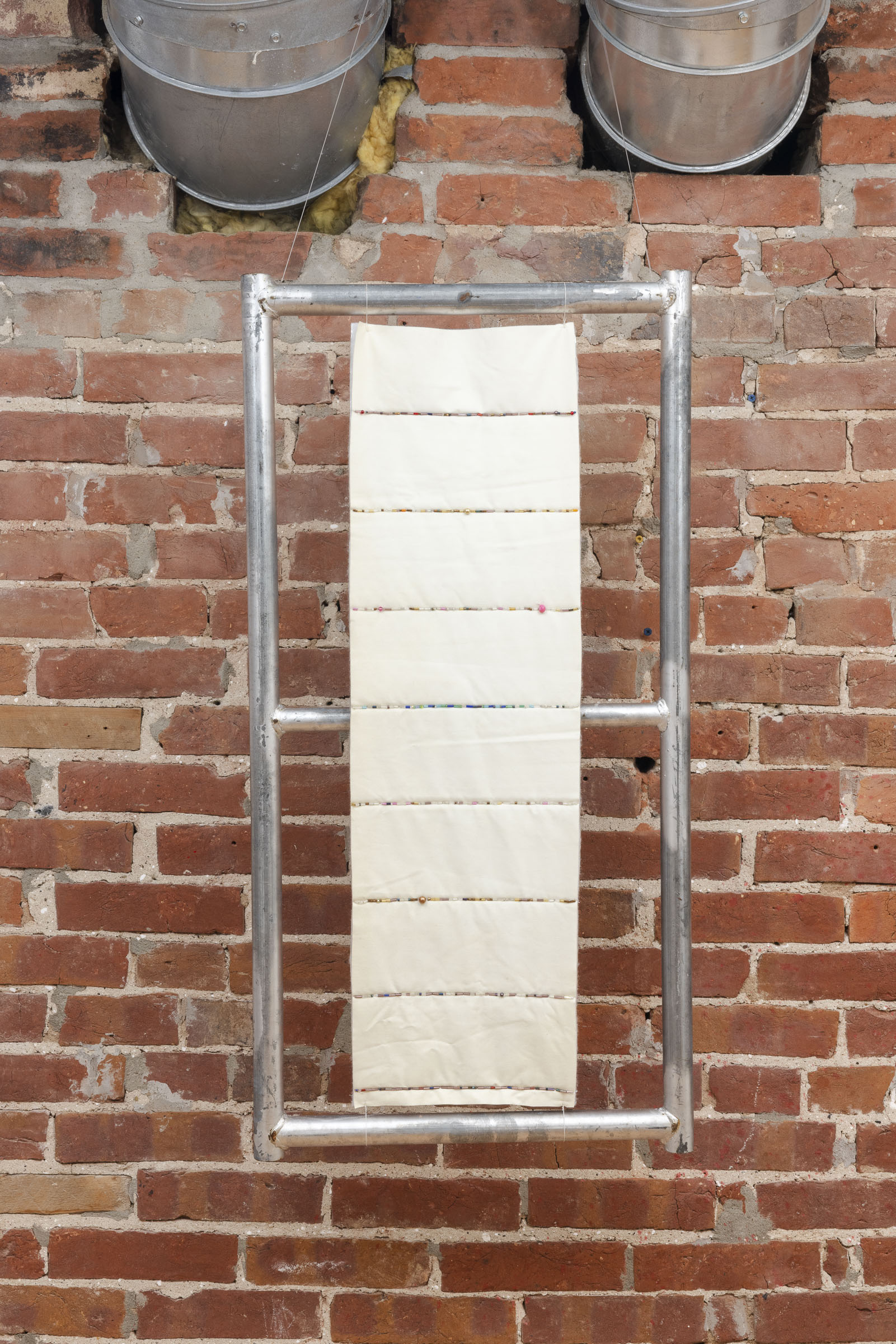 Top Rung | Found fence leg, quilt offcut, beads | 18 x 36 x 8&frac12; in | 2024