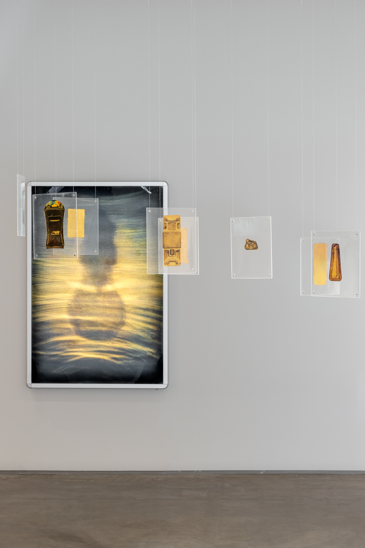 Robert Blake, "Oracle," ca. 2012. Gold leaf on acetate encased in plexiglass, 9 1/2 x 8 1/2 inches each. Photo by Rafael Gamo.