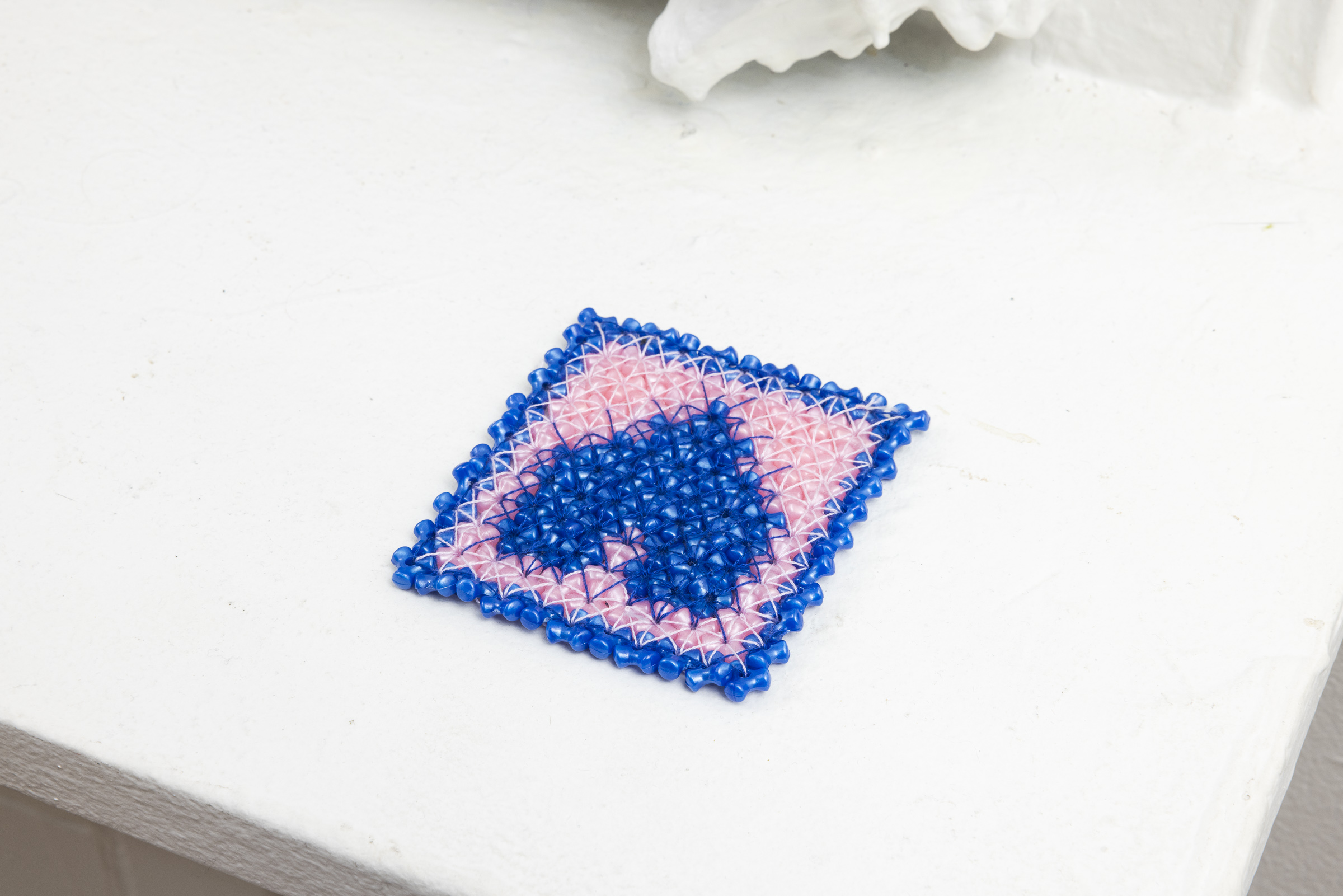 Housing | Triangular beads, embroidery thread | 3 x 3 in | 2023