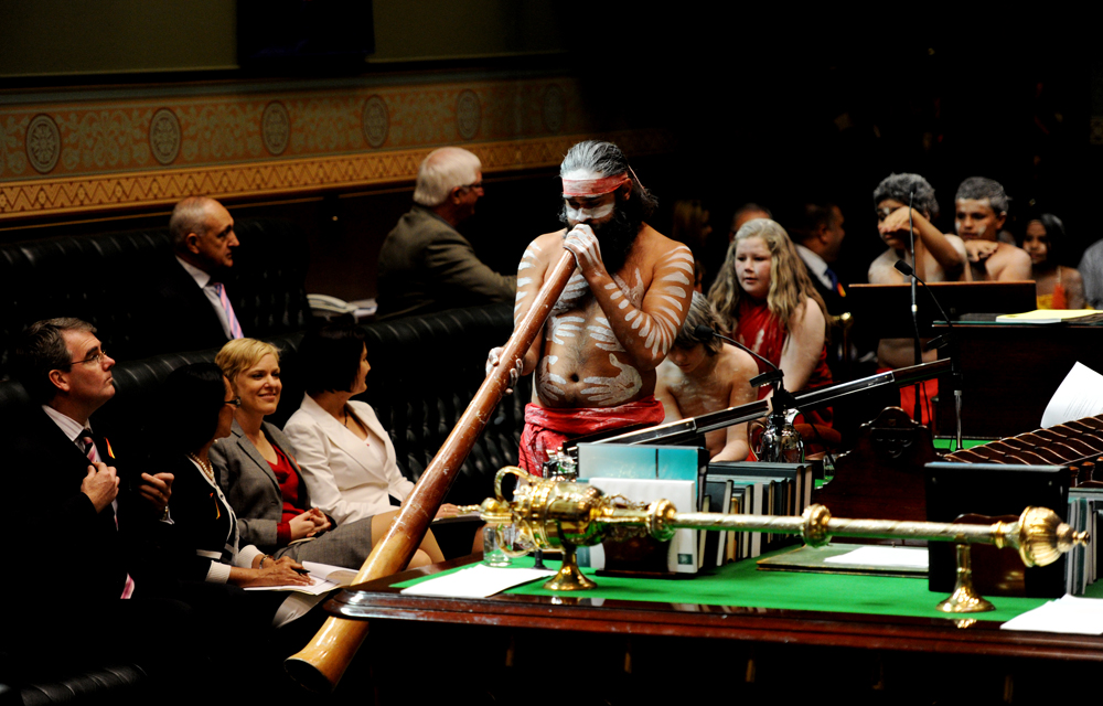 Members of the Aboriginal community dance through NSW parliment before a Bill to acknowledge Aboriginal People in the NSW Constitution Act 1902, 2010