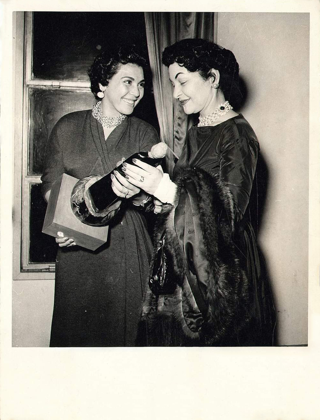 Dancer and member of Bint El Nil Union, Taheyya Kariokka and activist and editor Doria Shafik at an awards reception held for Kariokka long after she was released from prison on charges of conspiracy against the regime, 1953..