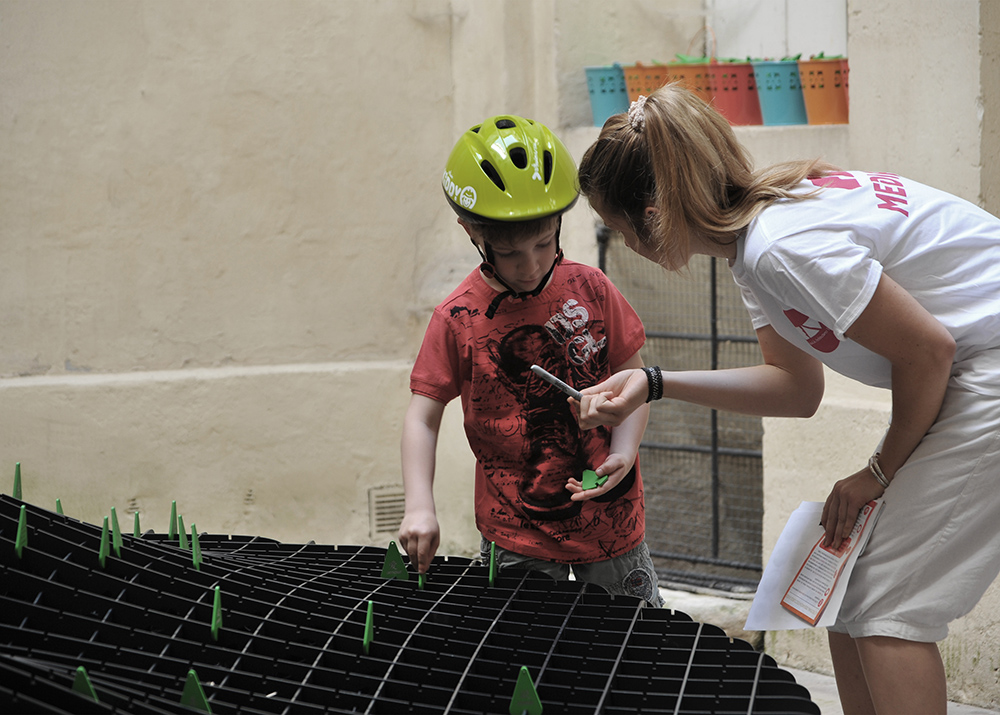 a visitor planting a tree