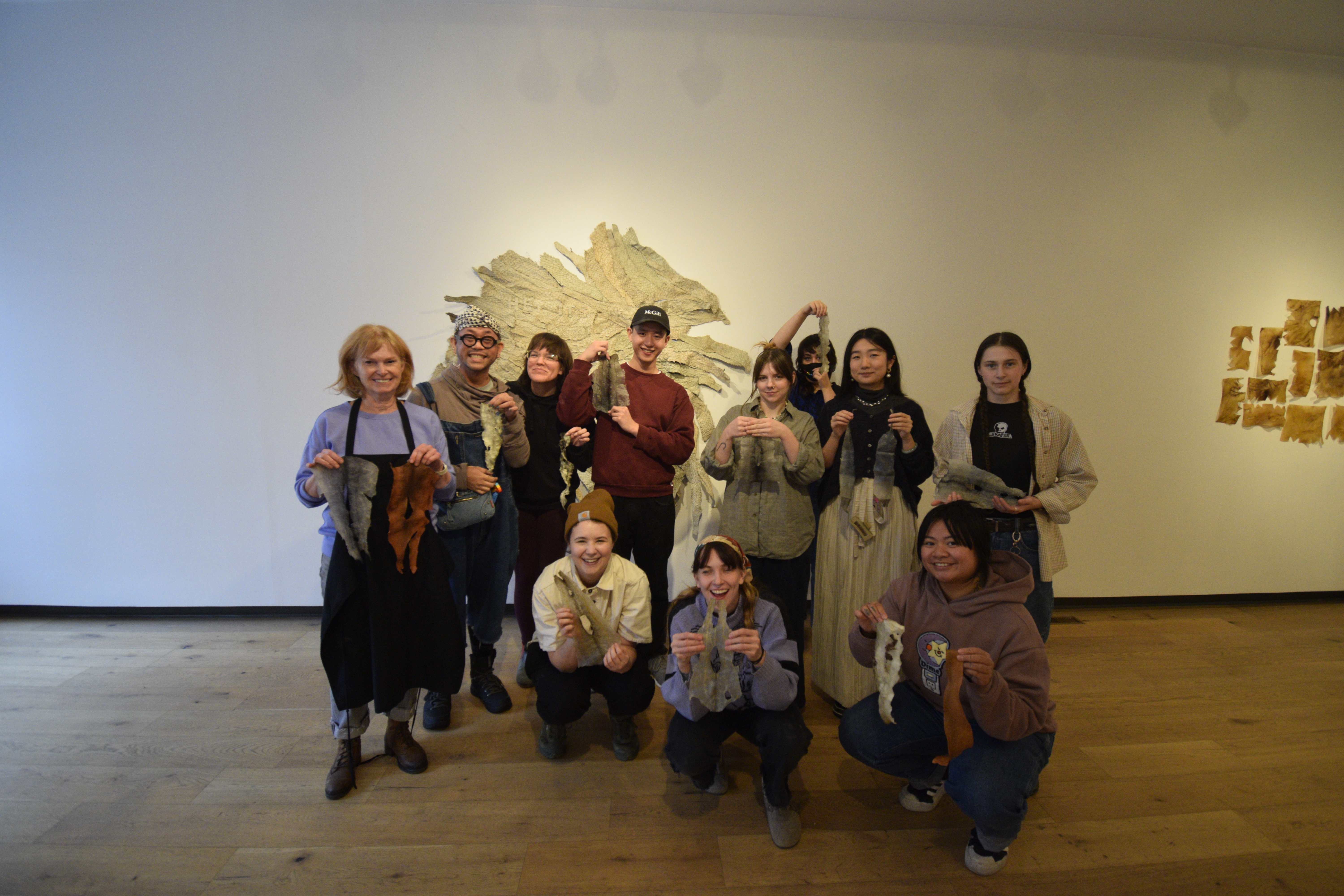 Photo from Morgan Possberg Denne's Fish Skin Tanning Workshop, coinciding with their exhibition My Fathers Cradleboard, 2023