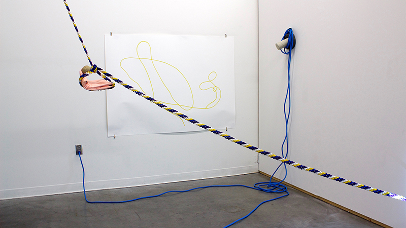 When I look at you, 2016. Acrylic paint on fabric, rock, ropes, single channel video projection, hardware, print on paper, and projector. Variable Dimensions