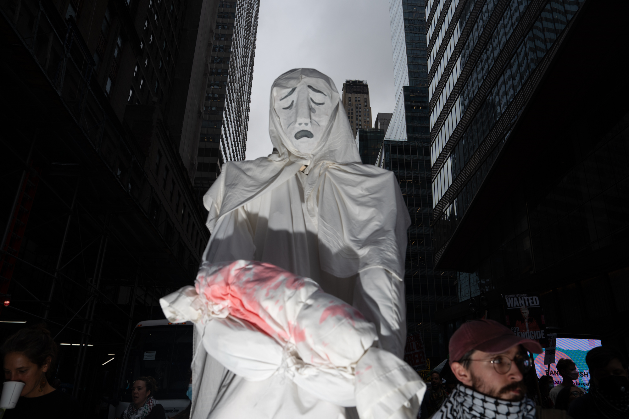 Pro-Palestinian protesters held up a large, ghostlike puppet with a sorrowful expression and fake bloodstains while marching to the U.N. Sept. 26, 2024.