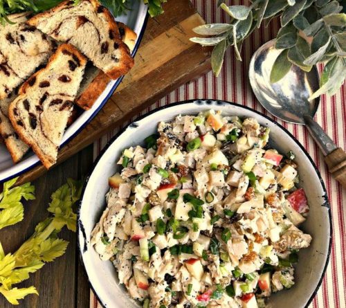 close up picture of a bowl of chicken salad with apples and lemon dressing.