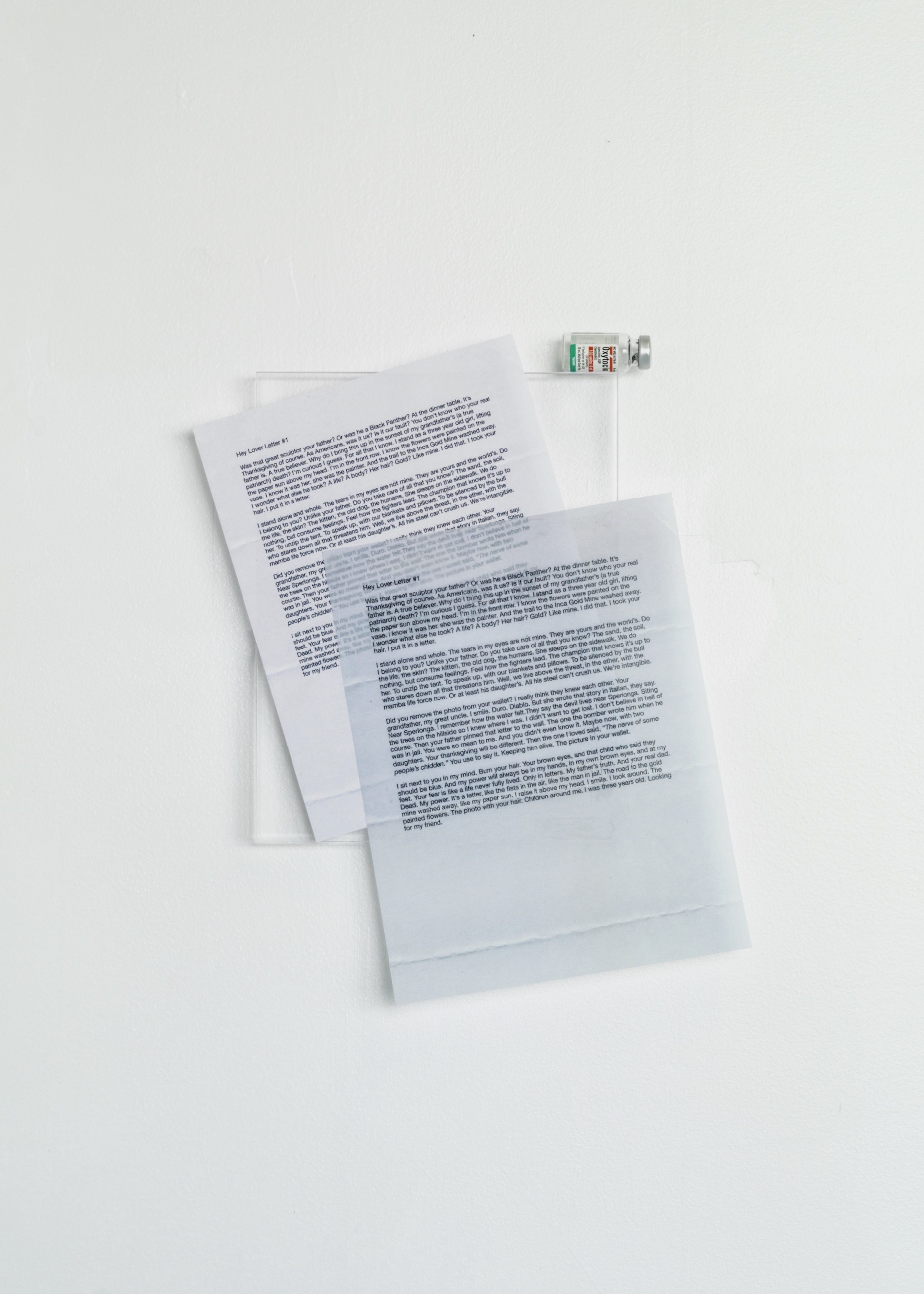 Hey Lover Letter Letter #1, 2019-2021, ink on translucent paper and oxytocin bottle mounted on acrylic glass, approx. 15 1/2 “ x 12 1/2”