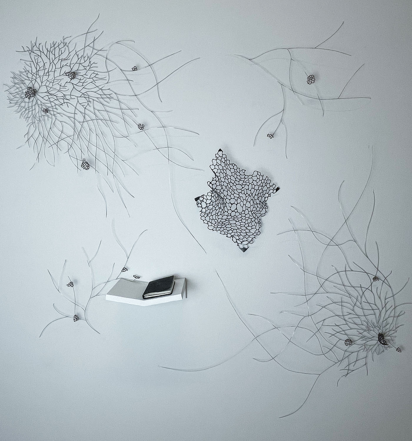 Sclerotia  Nickel wire, pierced copper, leatherbound notebooks, dimensions variable, 2022