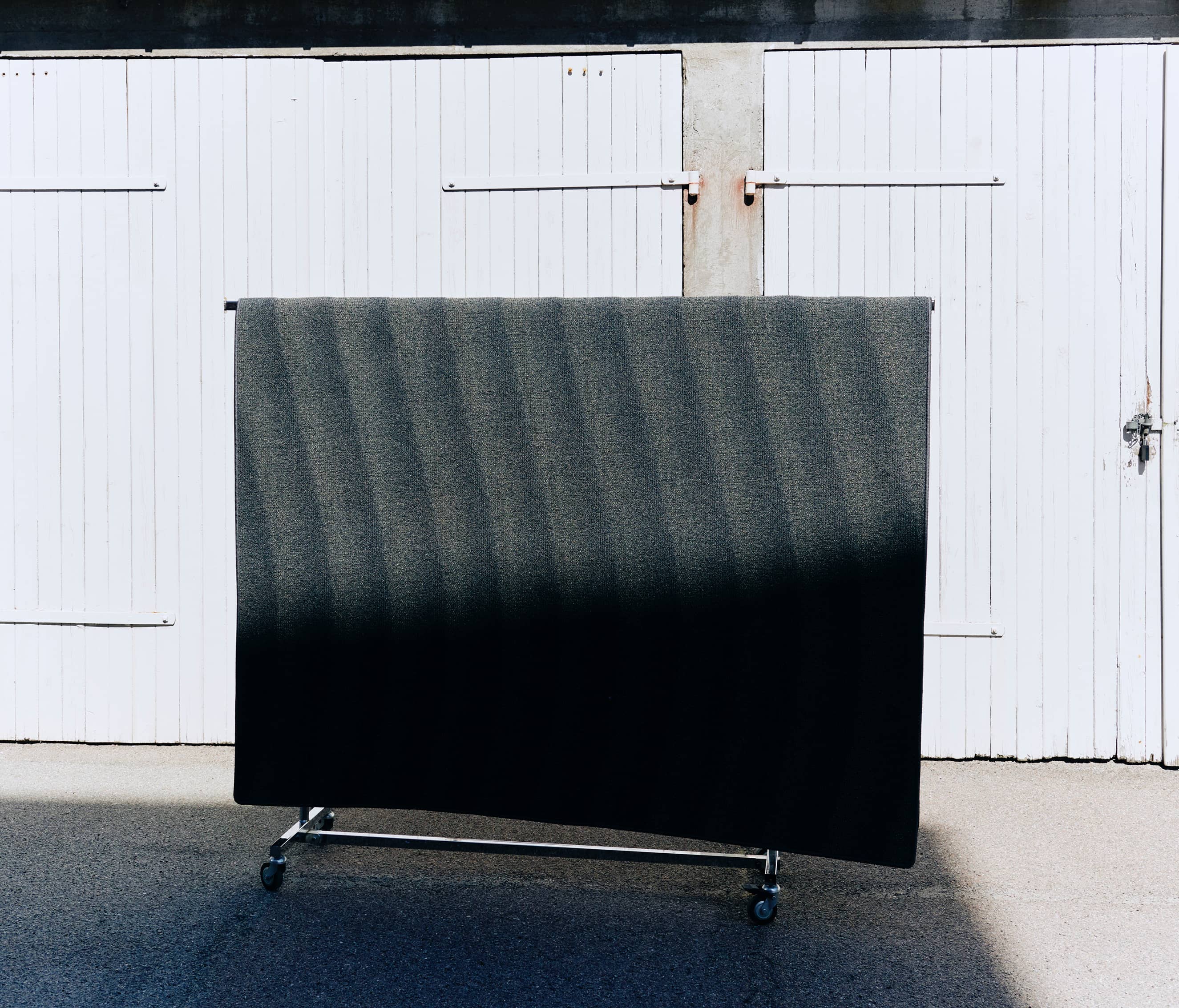 A NEW WAVE FOR EGEInspired by the rough and untouched landscape of the Danish west coast, A New Wave strives towards tactility on a functional and sensual level that allows you to feel the patterns of the sand, the strict lines of the grass dunes and the rhythm of the waves washing in. Multi levels in the carpet construction form the sculptural patterns while the colour palette reflects the dry and delicate tones of the seaside.The collection is crafted from regenerated and regenerable yarns based on abandoned fishing nets, used carpets and other industrial waste.Designed in collaboration with Laura BildeGo to product page →