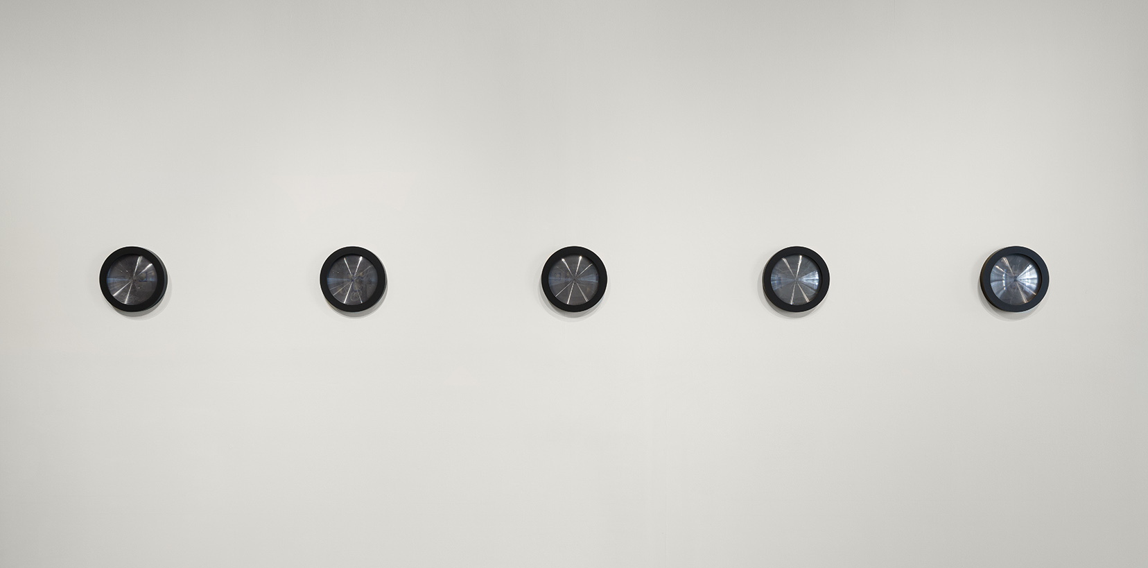 Aura Satz, "She Recalibrates," 2018. Pencil on black paper, framed with lenticular magnifying sheet, diameter: 10 inches each. Photo by Etienne Frossard.