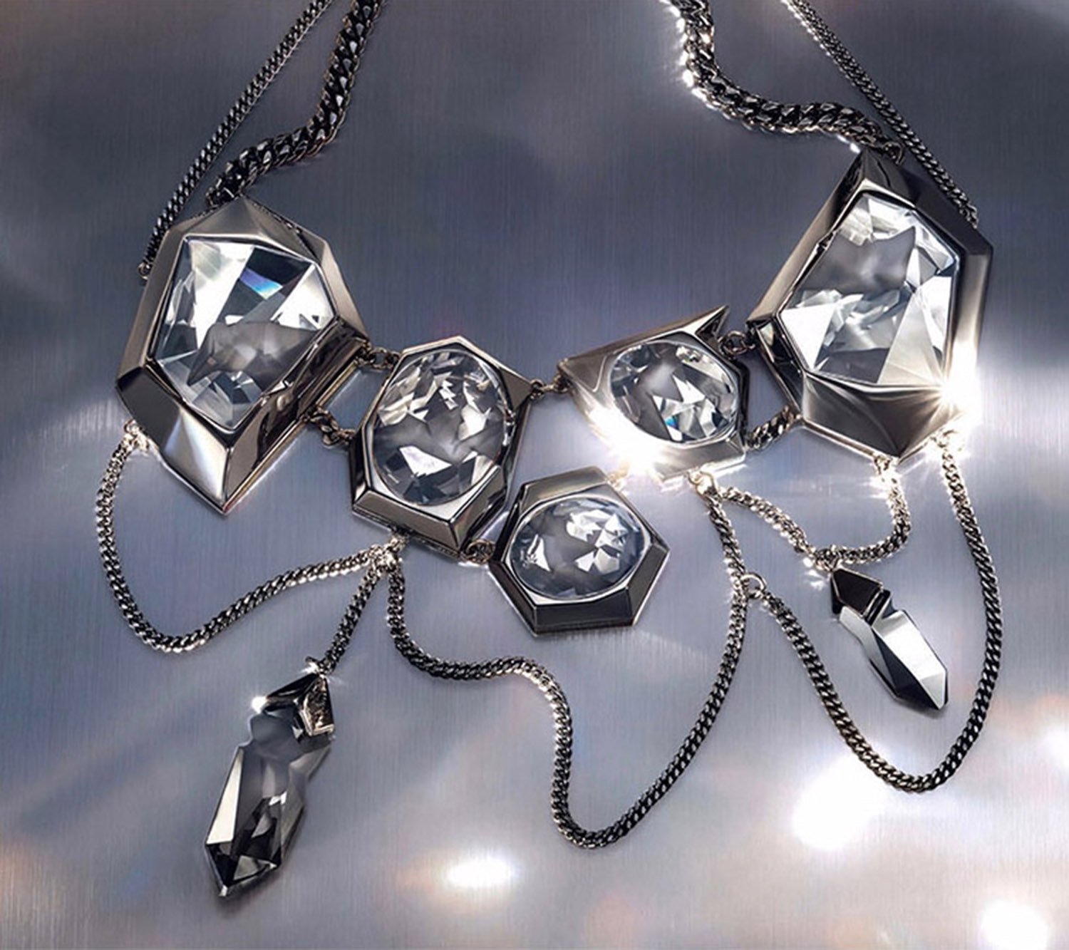 KMA stylist Sara Wacksman designs set for a photo of a sparkling diamond necklace with a grey shadowy background for Swarovski