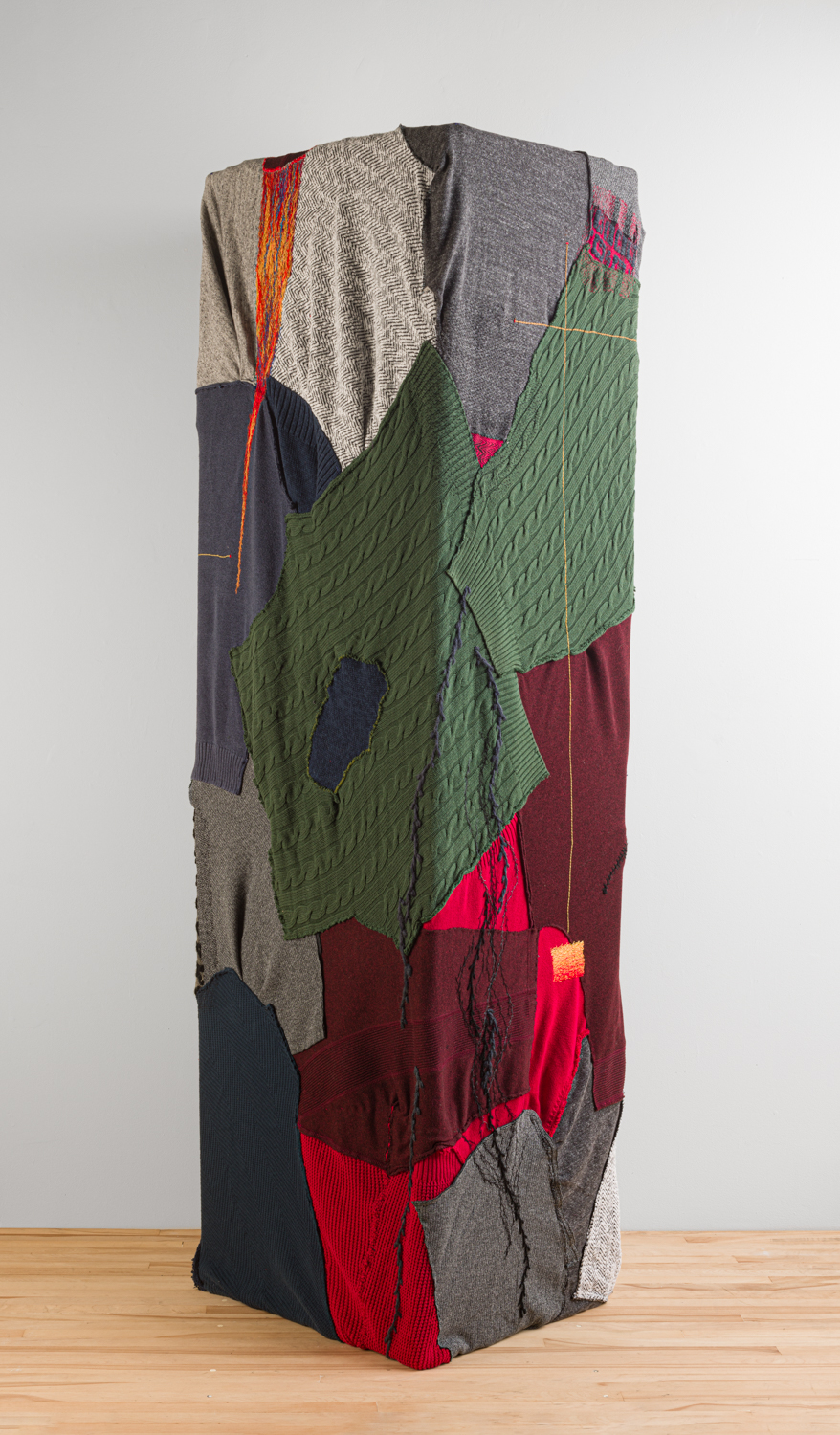 see how we are 7. 2025. Mending and embroidery on used dissected synthetic and natural sweaters, and pvc. 74" x 21" x 16". Photography by Tim Thayer.