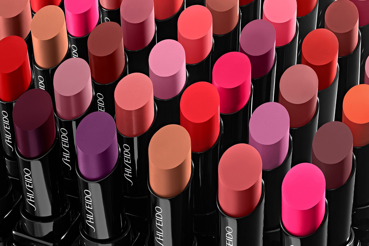 KMA stylist Rachel Haas designs set for photo of many colorful lipsticks with black tubes for Shiseido