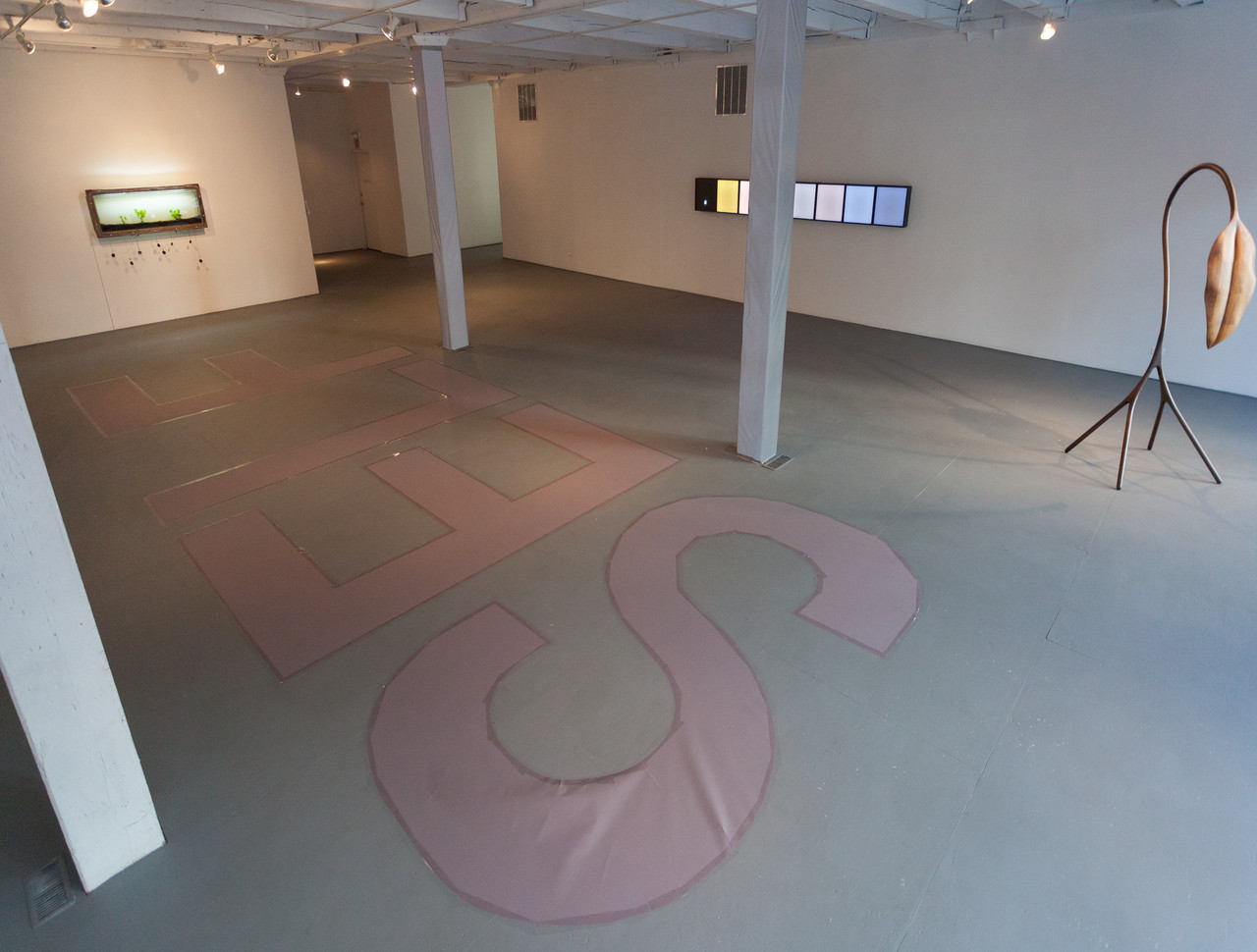 2/5 — SELFISH.  Site-specific installation created for the exhibition Hiding in Plain Sight, curated by George William Price at the Chicago Artist Coalition; hand-cut paper, packing tape; text on floor "SELF" measure 144" x 48" each, text on window "ISH" 96" x 48" each) 2017.