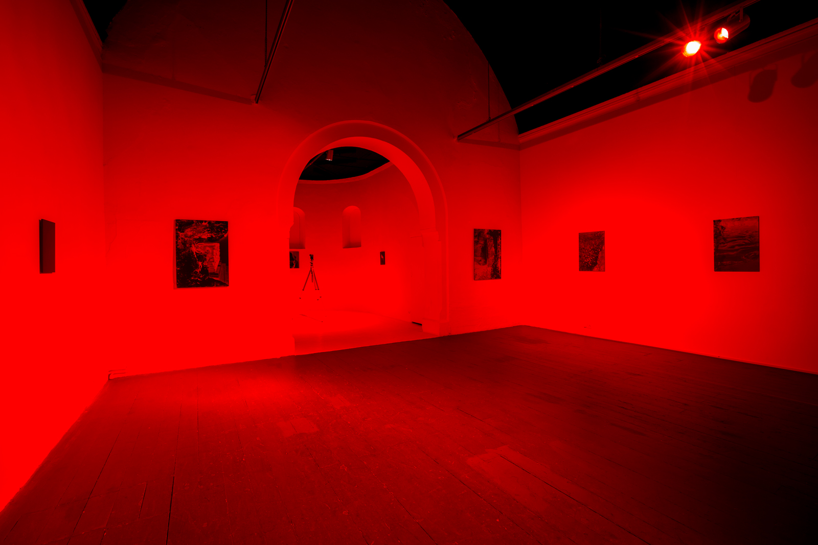  Chemically unfixed silver gelatin photographs, red darkroom safelight. Installation view, Mission Gallery. From the Series Divisible Remainder.