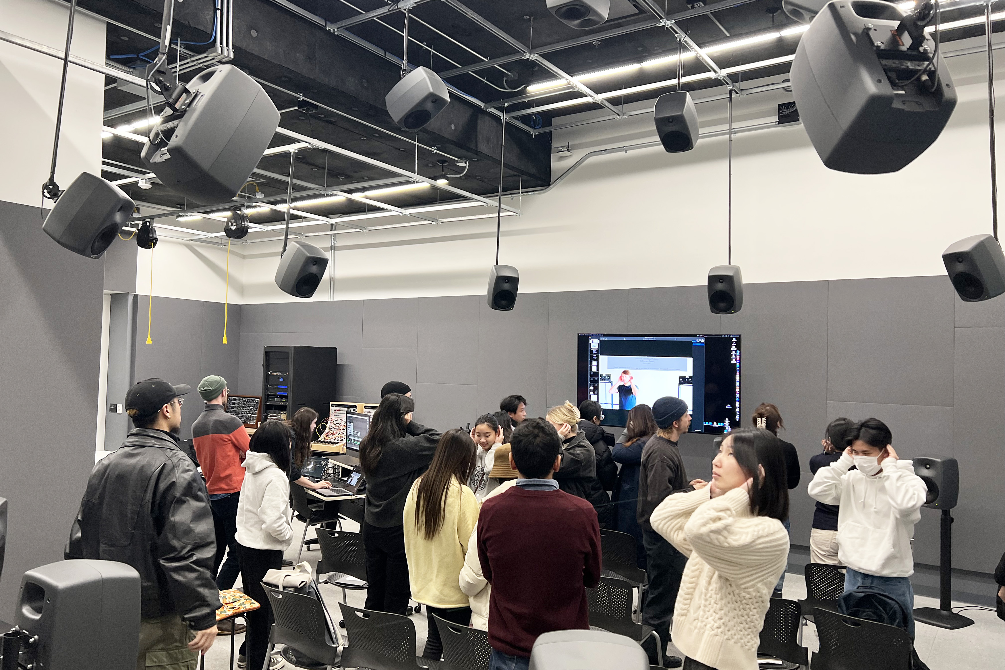 Students listening to sounds their ears produce while experiencing Chechile’s work ︎︎︎