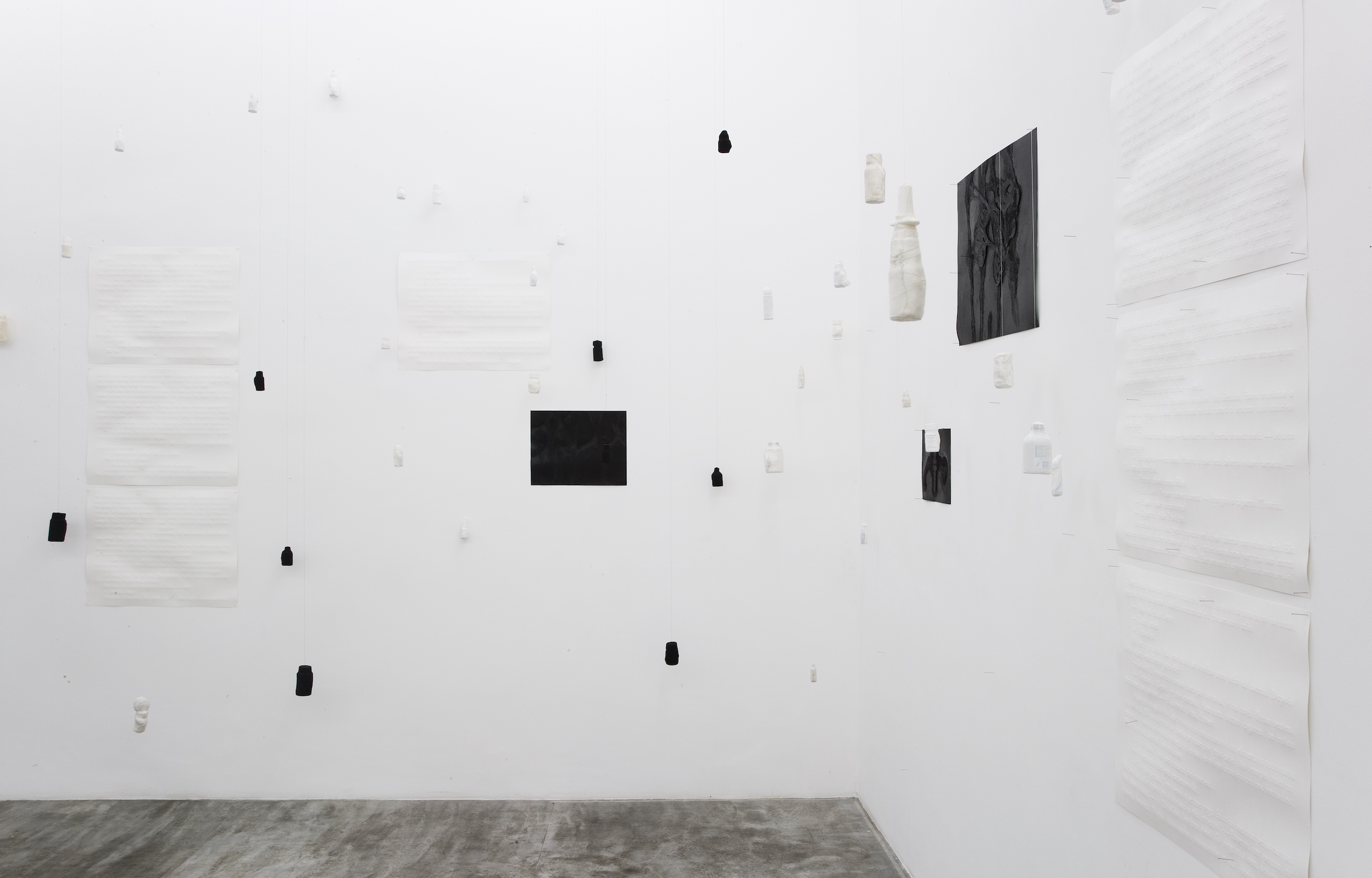  Caio, Felix, Perfurações e Cortes, 2008 . Carved paper, perforated paper and medicine bottles covered and embroidered with various fabric . Sizes and dimensions variable . At Galeria Vermelho, São Paulo, Brasil