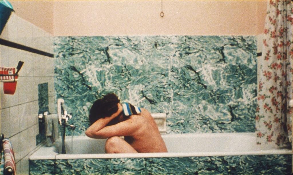 Akerman, Chantal. Bathroom Scene, Taking a Bath. Photograph. 1976.