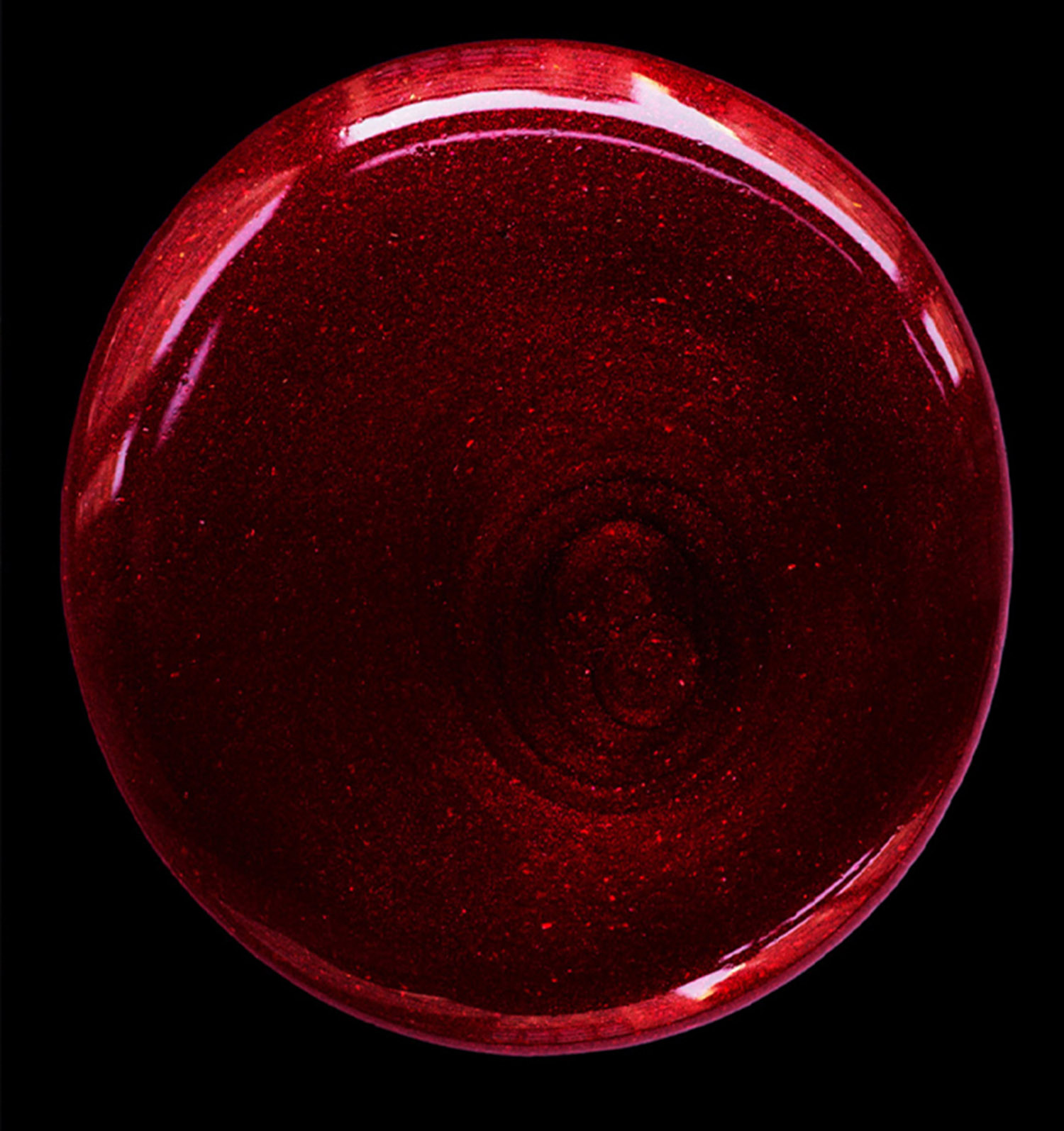 KMA stylist Sara Wacksman designs set for photo of a drop of red glittery lip gloss against a black background for Vogue