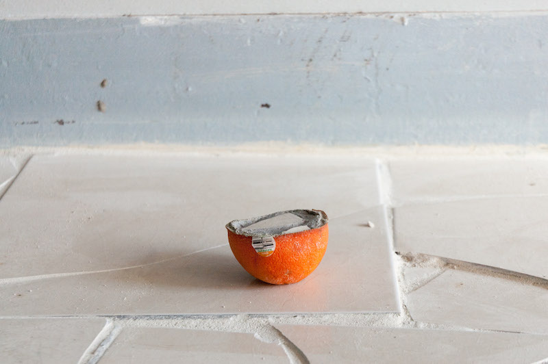 Samuel Payne, 1,380 lb Gambit, June 20, 2013-March 8, 2015, Tile, thin set, grout, chalk line dust, fruit peels, photograph, threshhold, dimensions variable