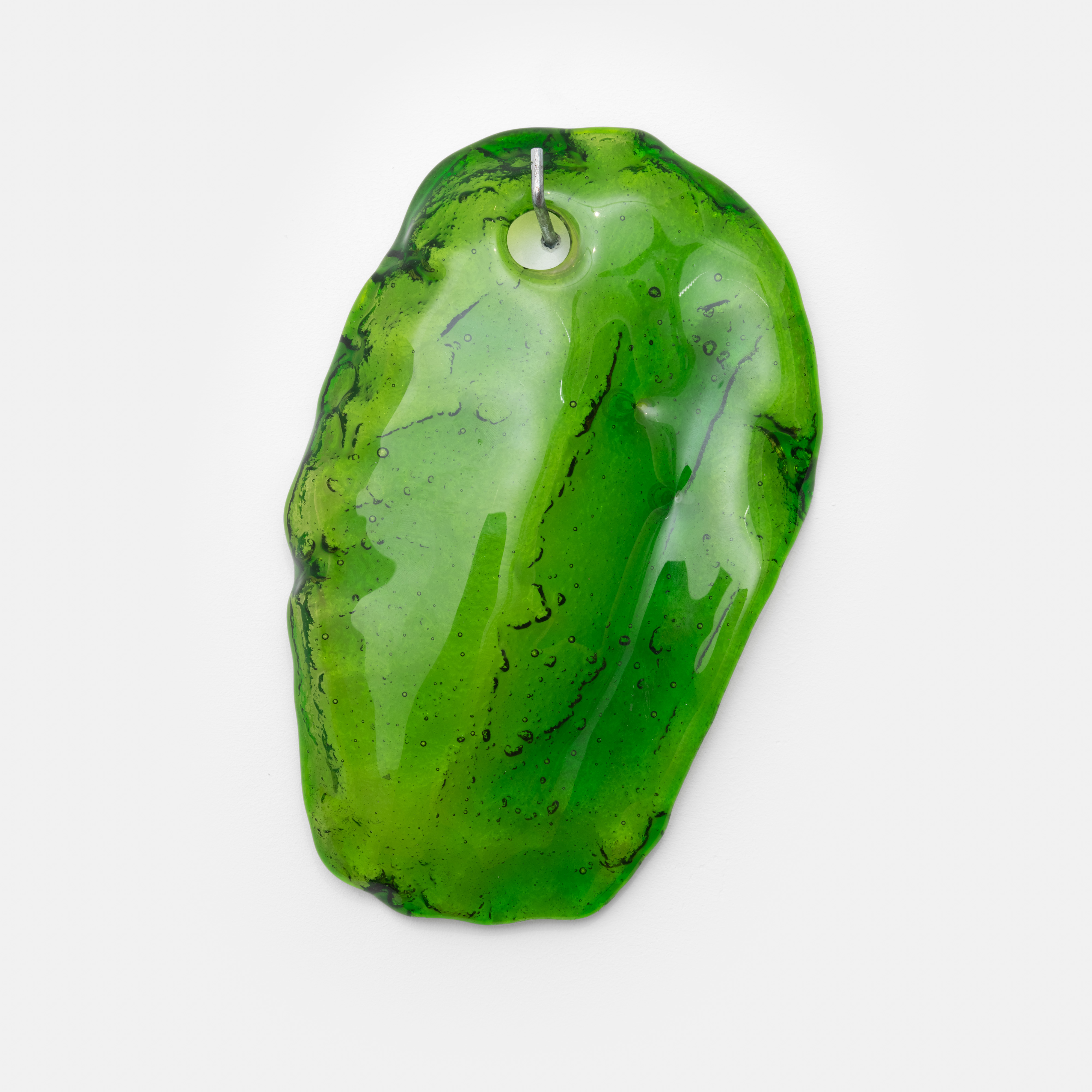 14.83 HZ (OVERTONE), 2024, slumped glass 25 x 15 x 2.7 cm