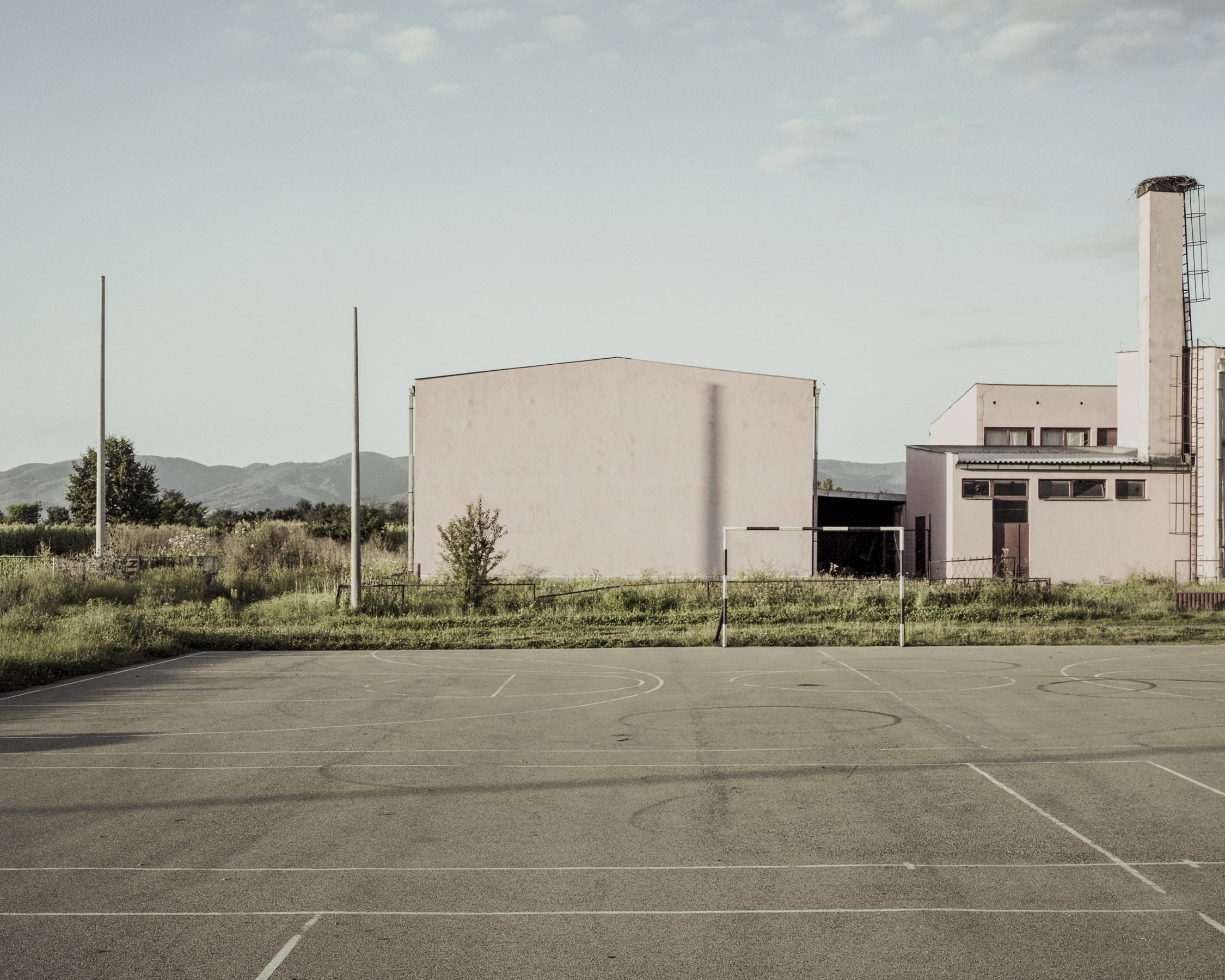School ground, Trnopolje. It was referred to as a «refugee reception centre» or an «open camp» by Serb authorities. However, according to one report, Trnopolje was actually run like a detention centre from May to August 1992. The camp was discovered by two crews of journalists on 7.08.1992, and one of photographs, depicting emaciated Fikret Alić behind barbed wire, was later printed on the cover of Time Magazine.